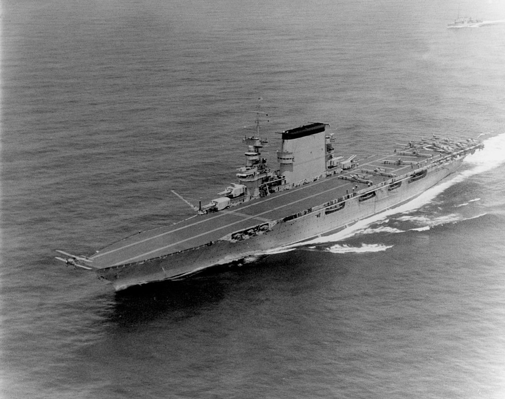 U.S. sailors abandon the aircraft carrier USS Lexington after she