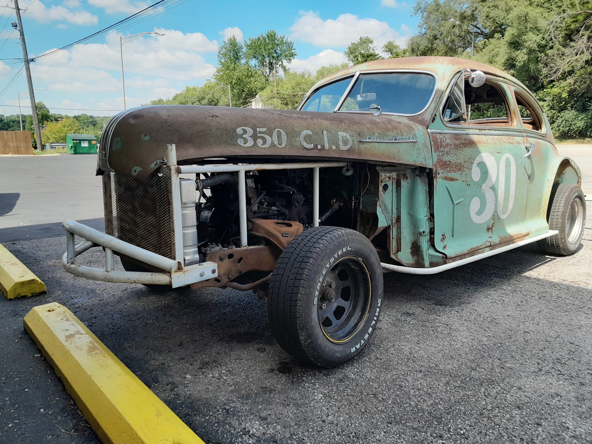 Vintage racing cart with twin McCulloch MC-10's at local car parts