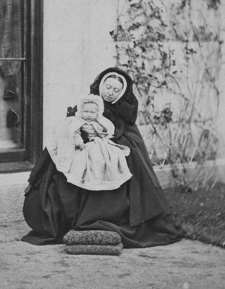 Hand-coloured photograph of Queen Victoria with her granddaughter