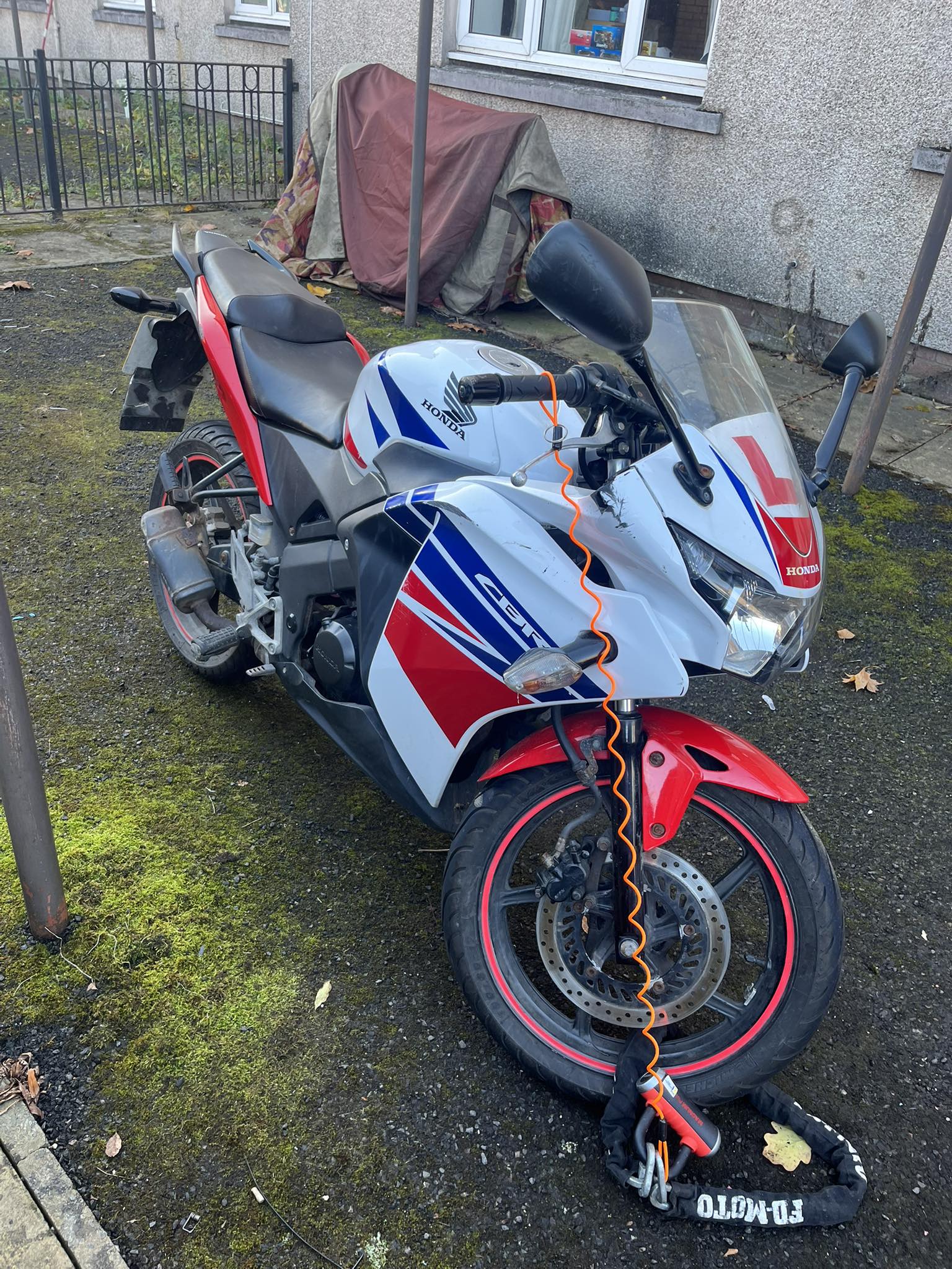 Who owns the red white and blue CBR125R with reg SA16JTD?