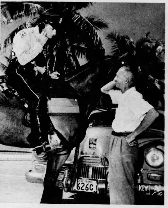 Miami - 1949 Miami Mounted Police officer O.K. Dudding checks license ...