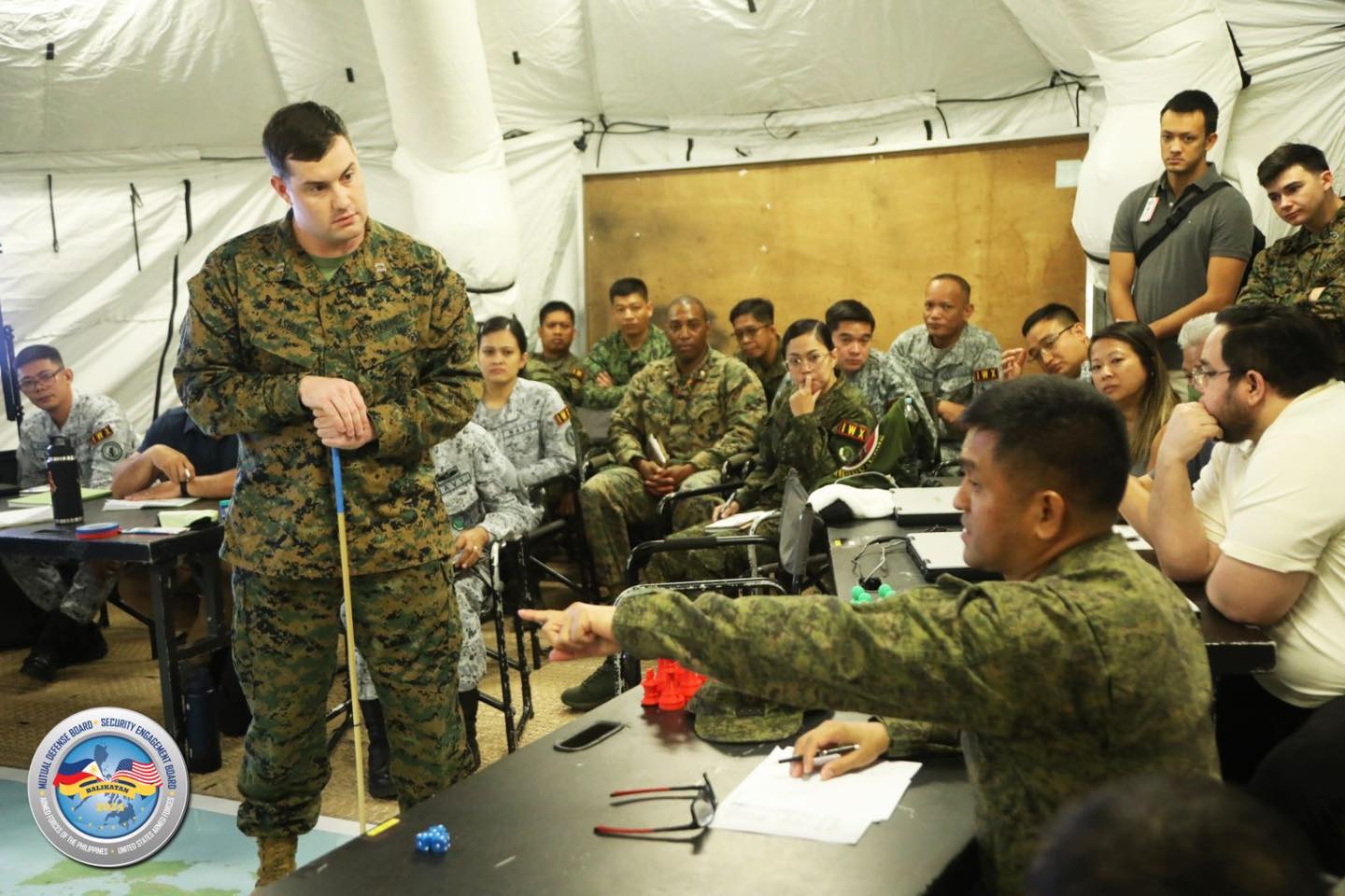 Armed - US Marine Corps Capt. Ryan Ashley listens to the question of ...