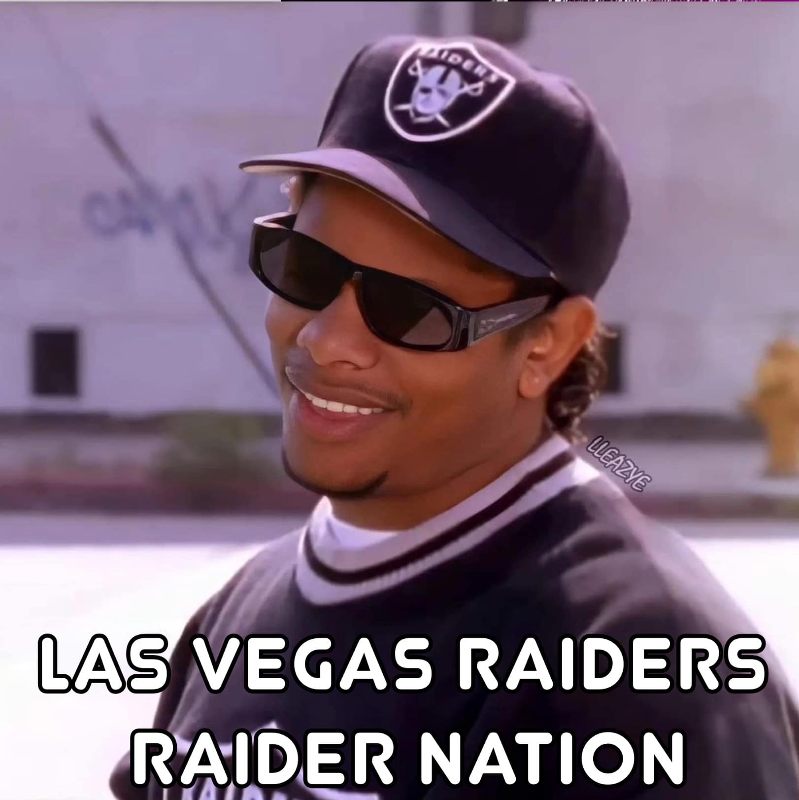 Eazy-E showing off his Las Vegas Raiders fit