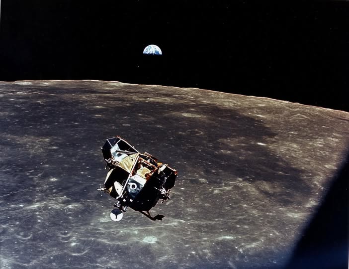 Interstellar - With a half-Earth in the background, the Lunar Module ...