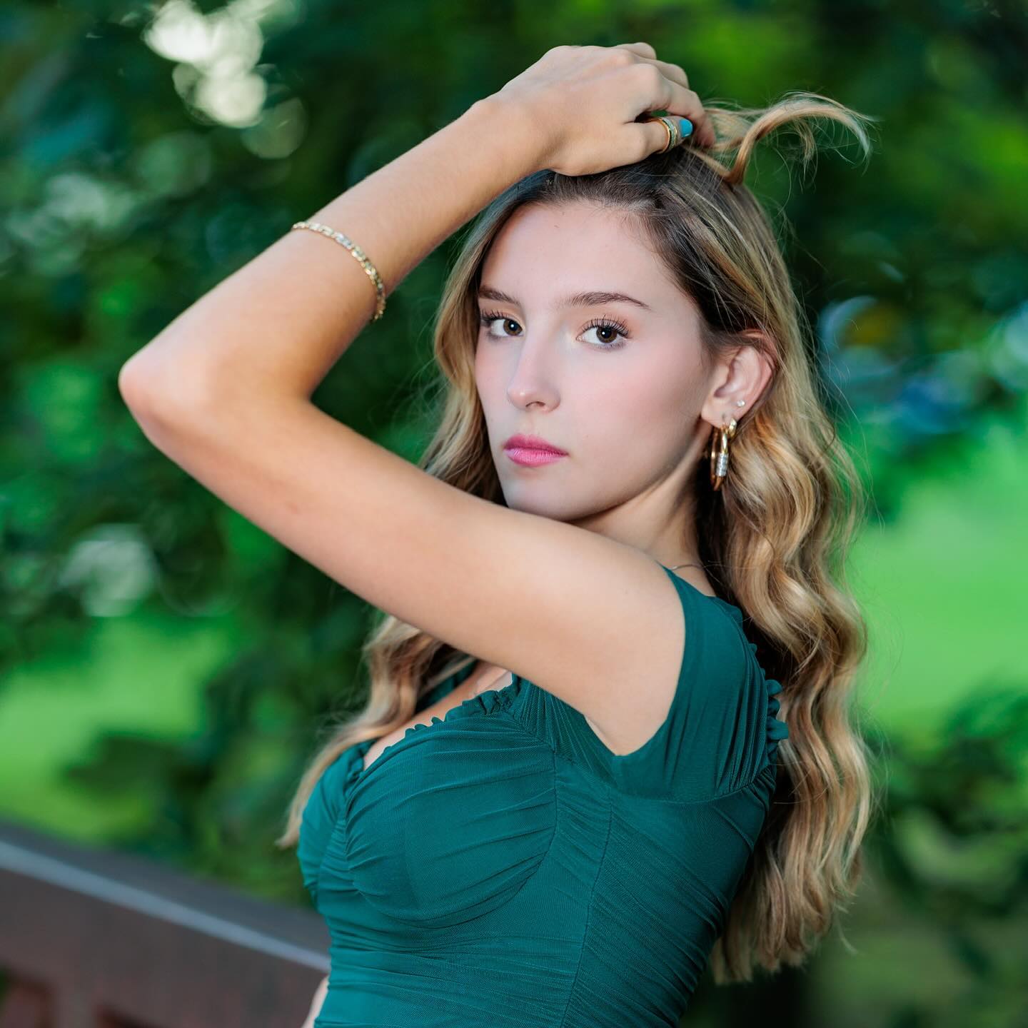 Stunning brunette model in green dress