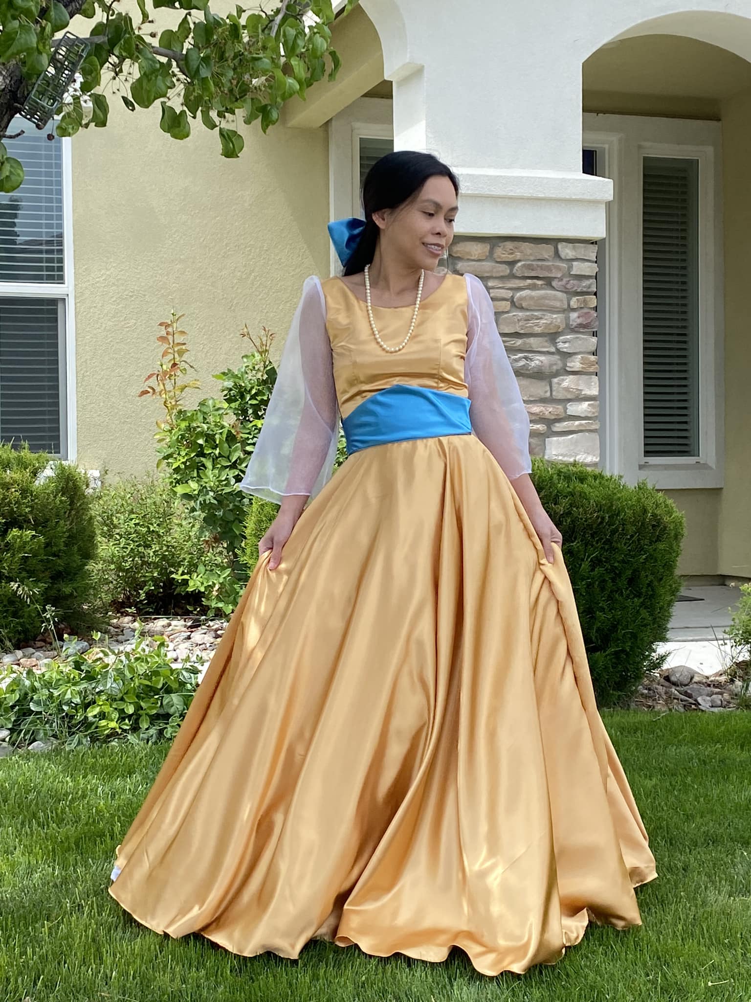 Which Disney princess dress is this blue grayish dress similar to?