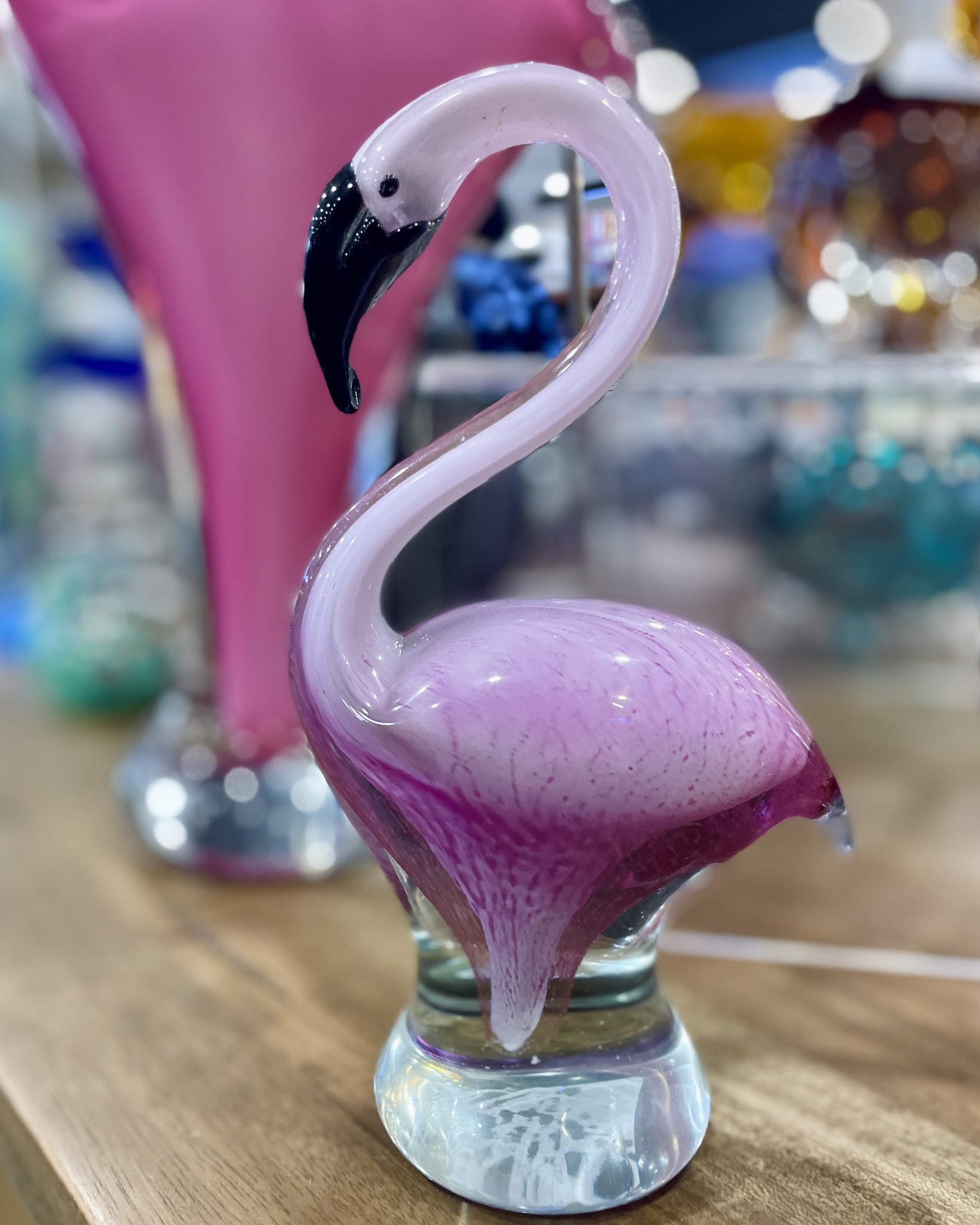 An elegant glass flamingo in a lovely shade of pink awaits you in 