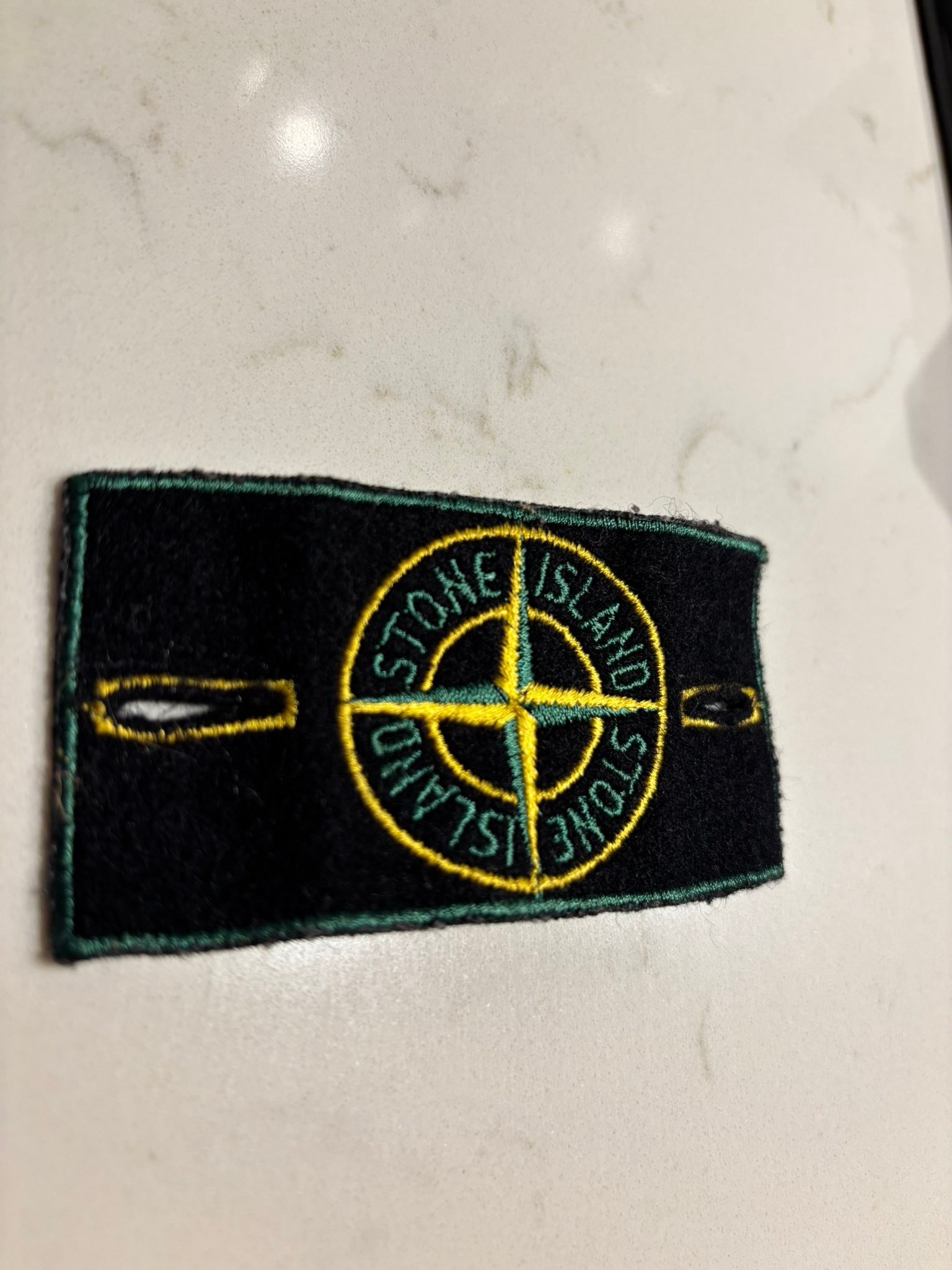 What is the Stone Island green edge badge with art number AW98?