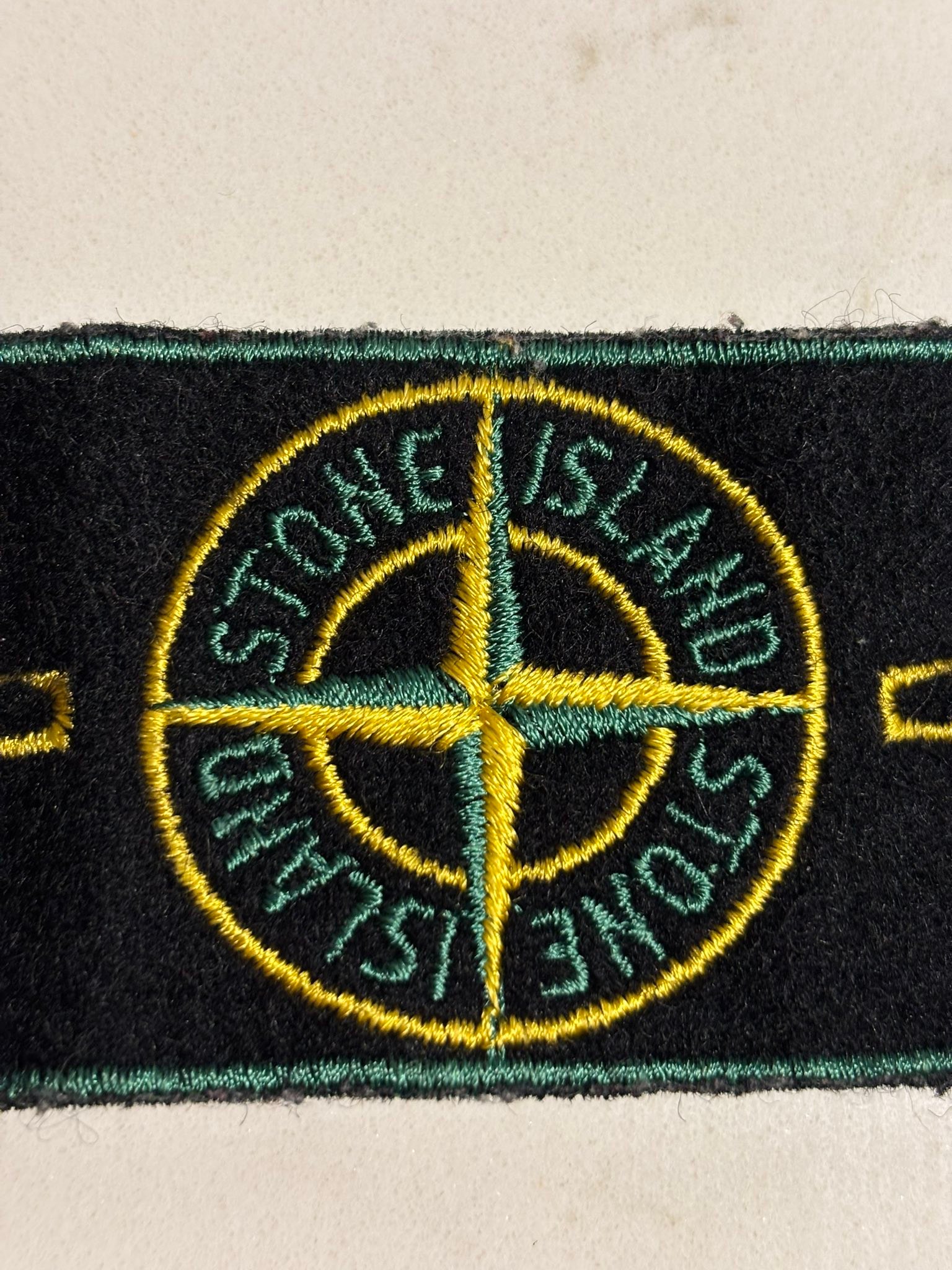 What is the Stone Island green edge badge with art number AW98?