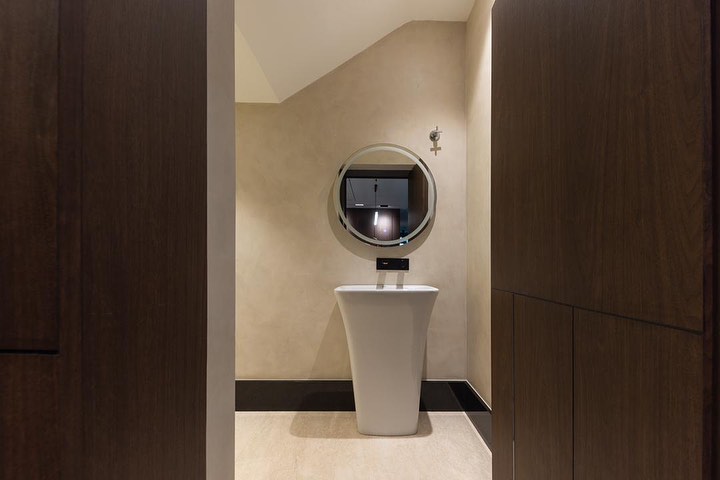 The powder room was designed to... - Framework Design Studio