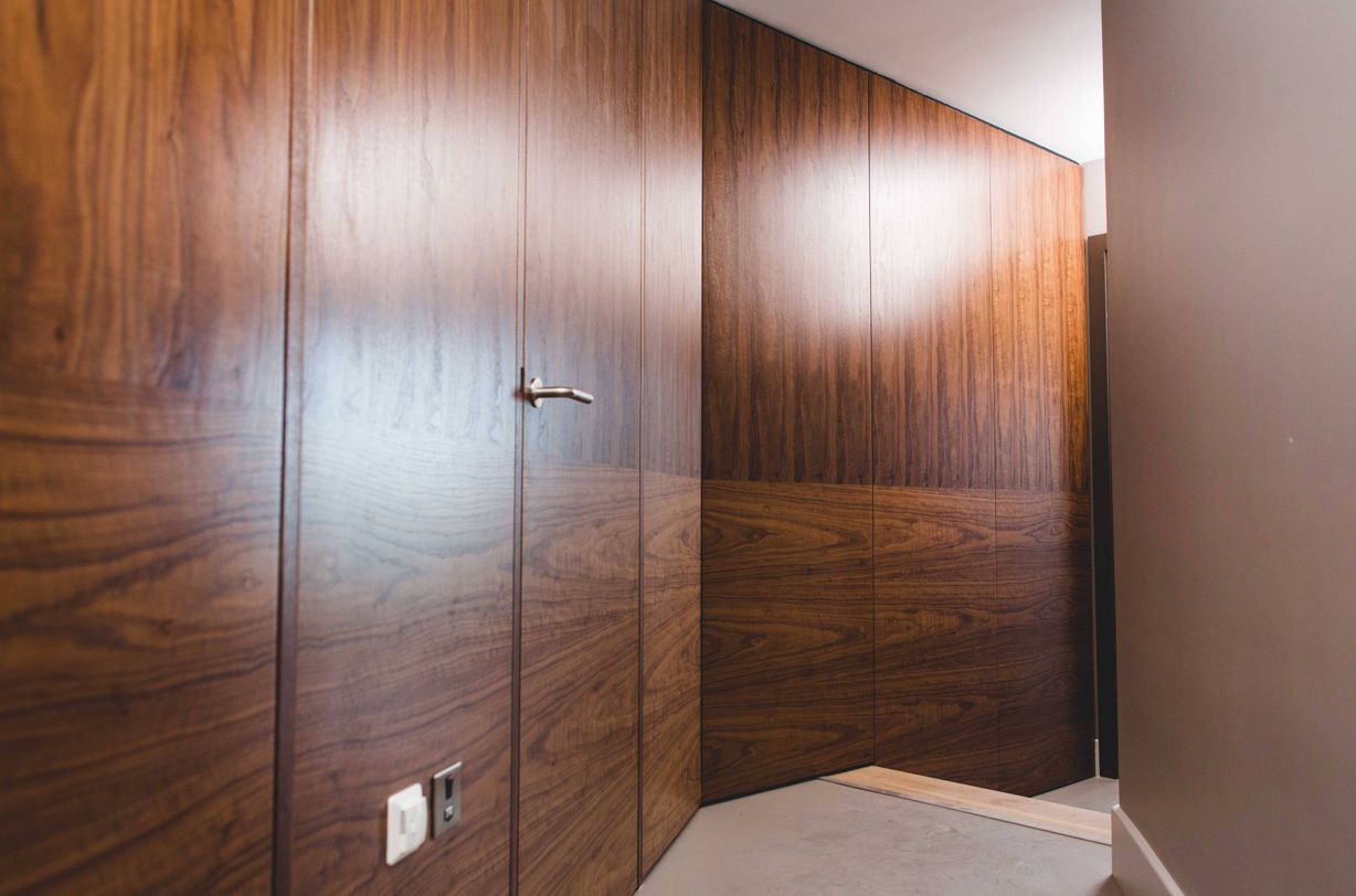 Picture of Graefe Doors - Our striking American Black Walnut wall panels line the ...