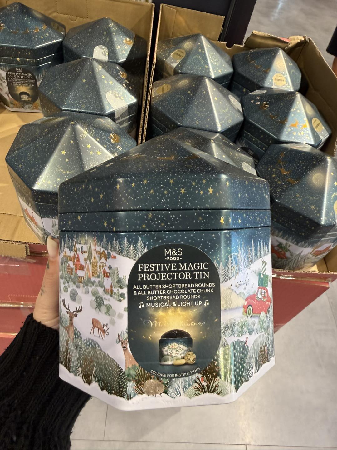 Musical, light up projector tins filled with biscuits new in at M&S