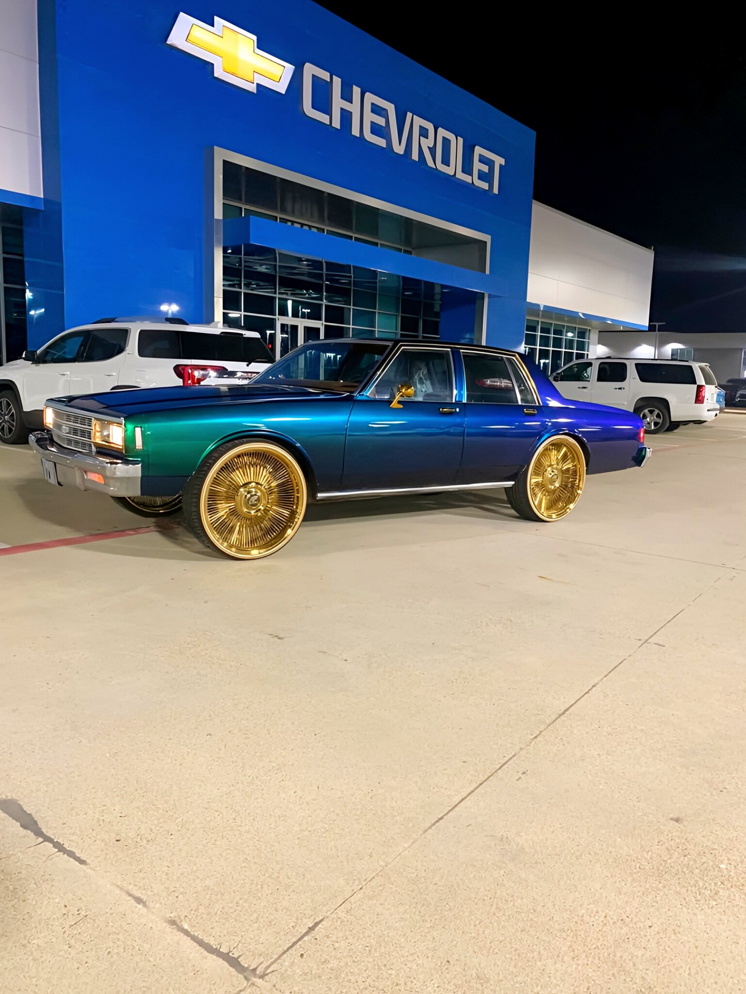 2 door slime green box chevy on 26 inch chrome spokes