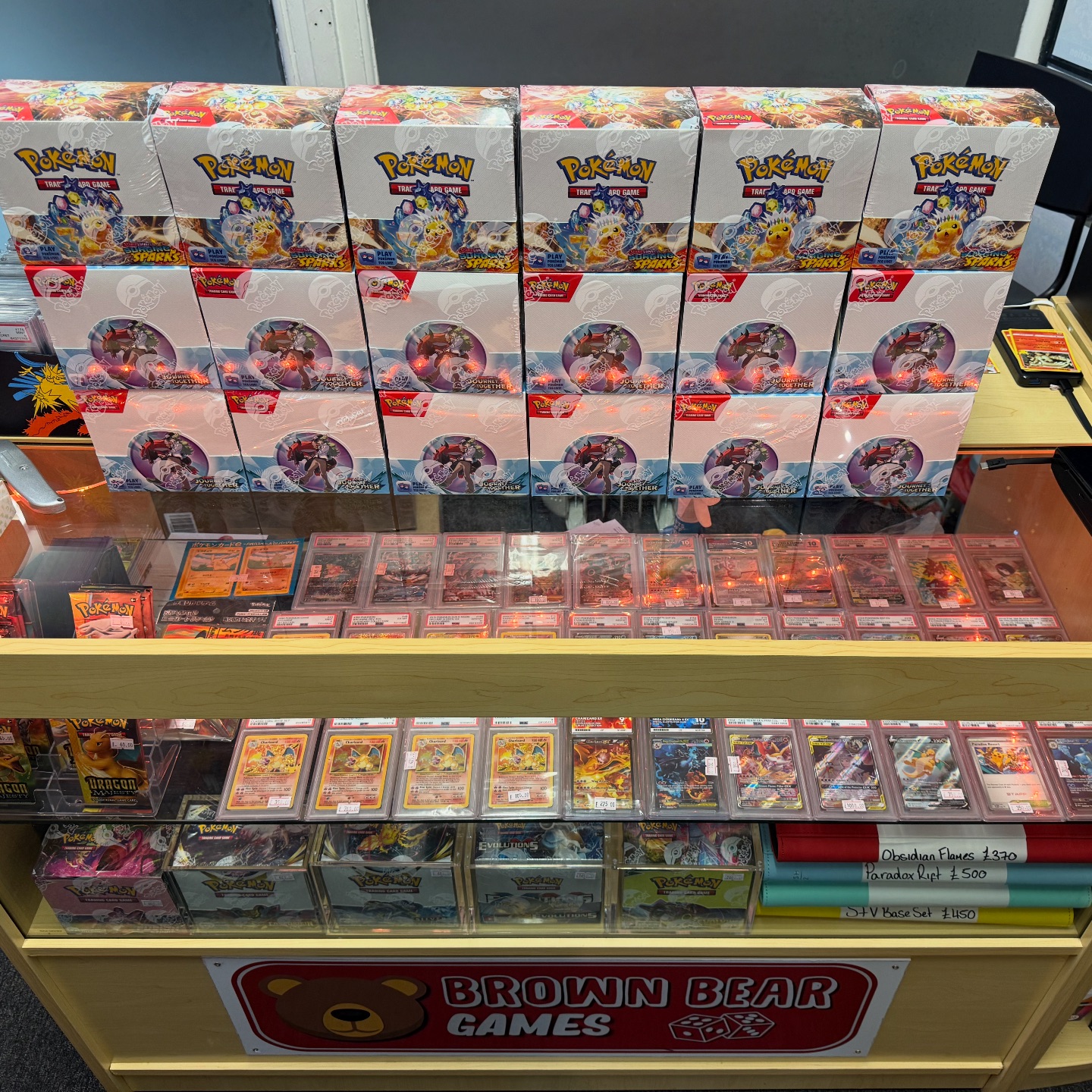 what stores sell booster boxes S&M Team Up Box Case SM09 Use booster packs to add to players collection and enhance gameplay Disney - Lorcana: Whispers in