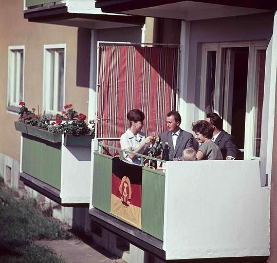 Soc - Plattenbau life in the GDR: a family celebrates on a balcony of a ...