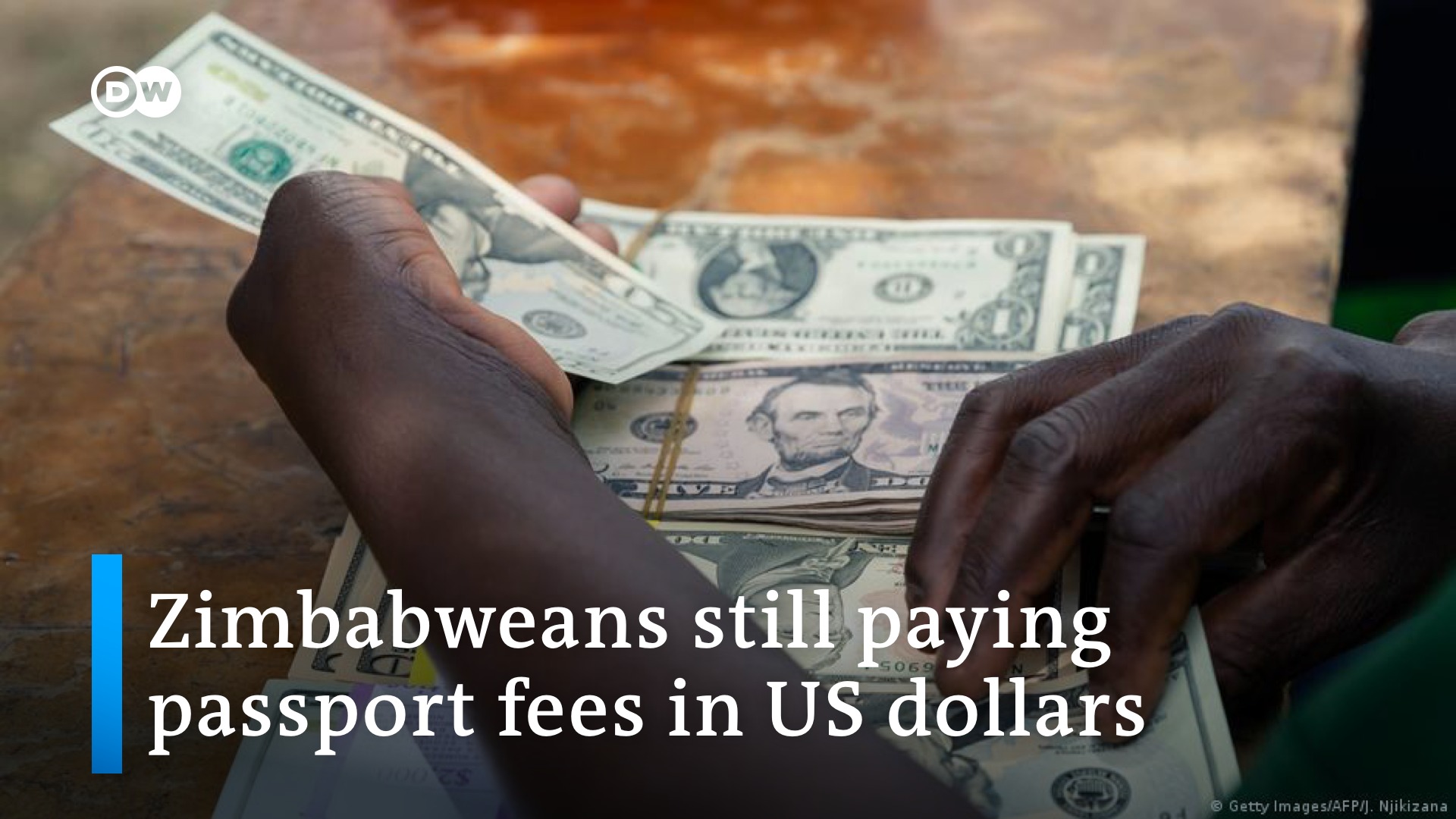 DW - Zimbabweans can expect to continue paying passport fees in US