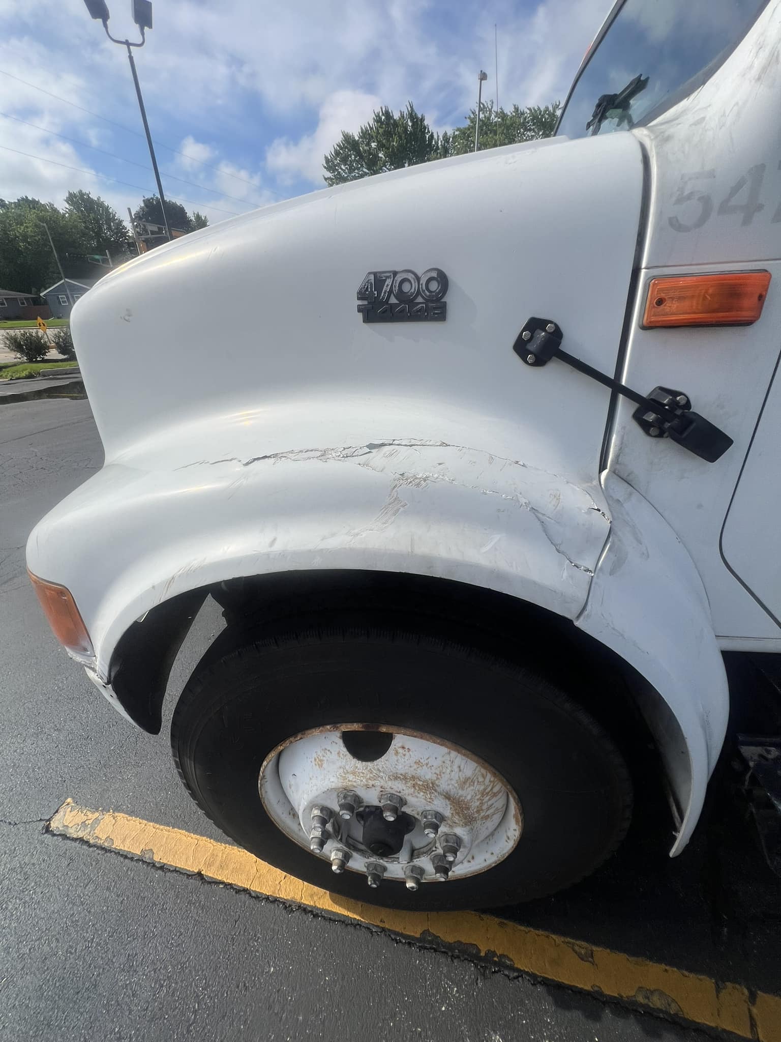 Fiberglass repair for cracked skid loader hood