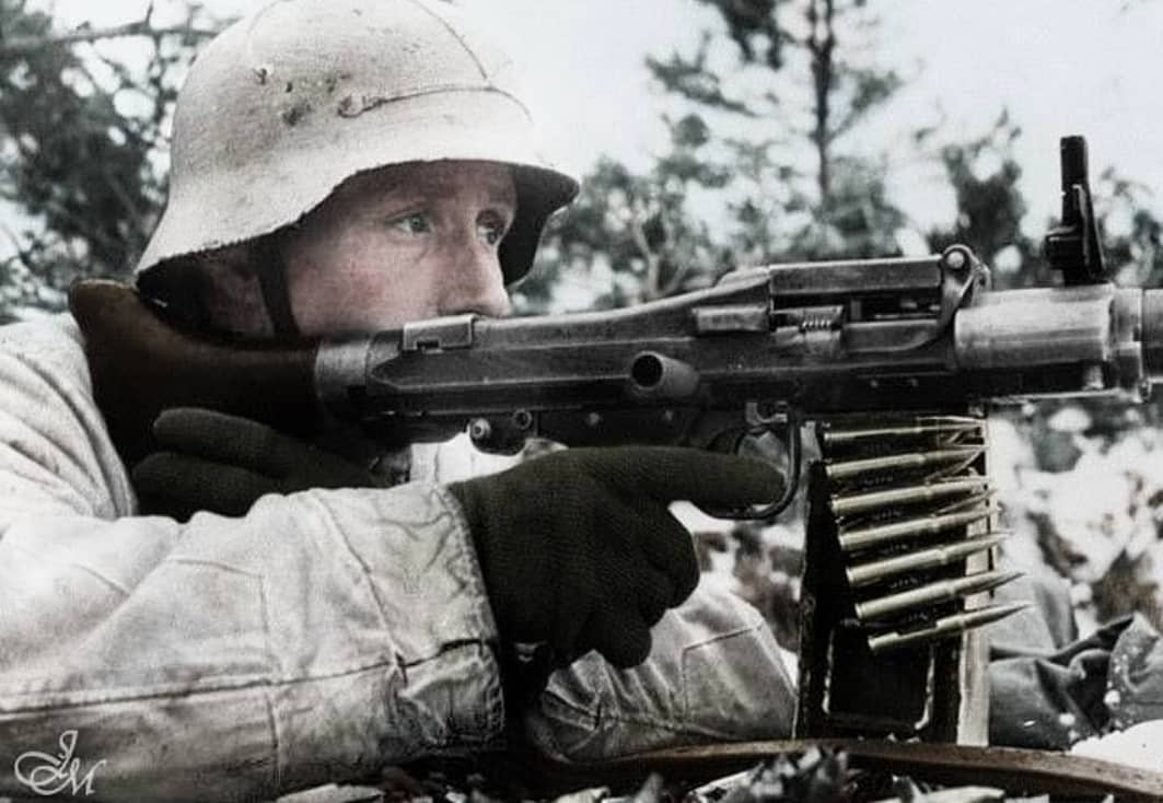 Vito - A German camouflaged soldier firing with his MG-34 during the ...