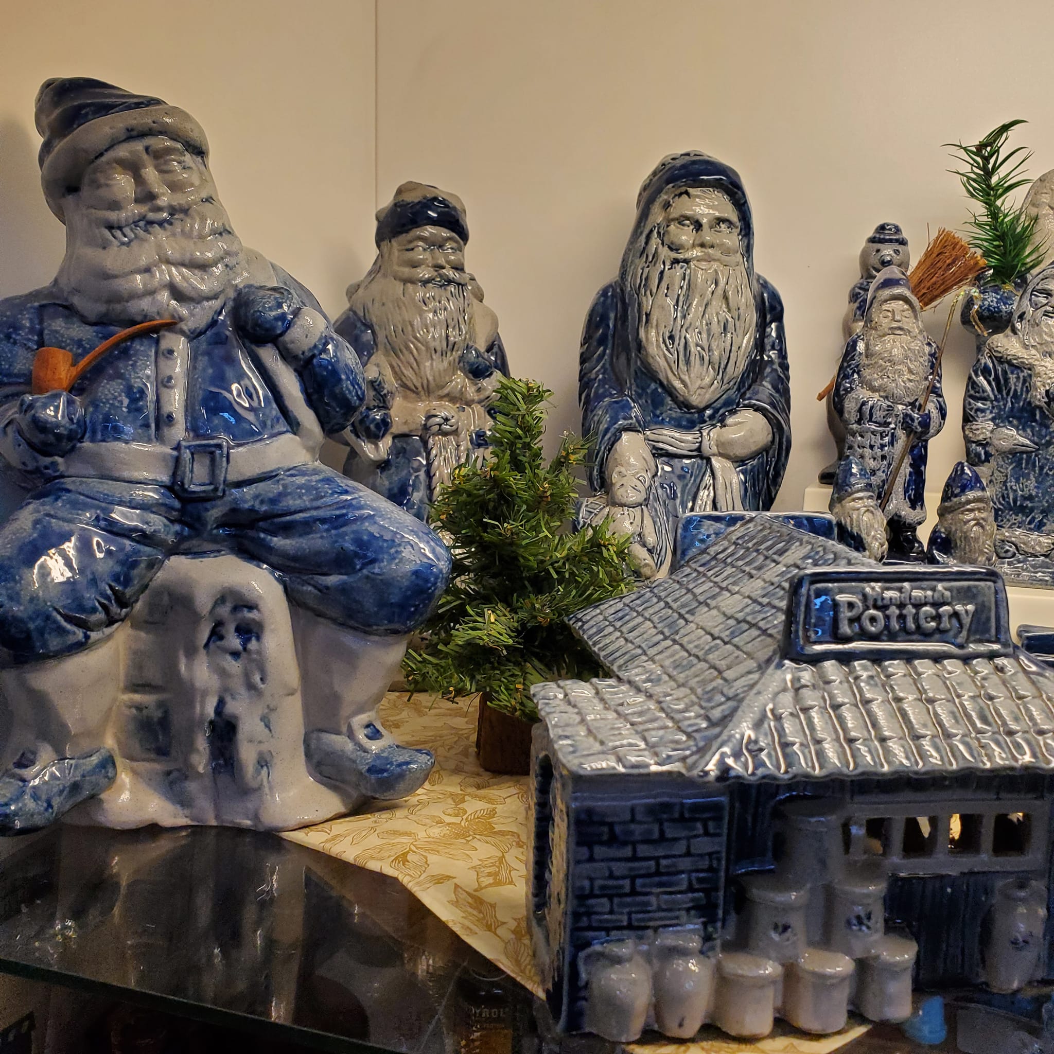 Rowe pottery Santas and village pieces at Five Star Antiques