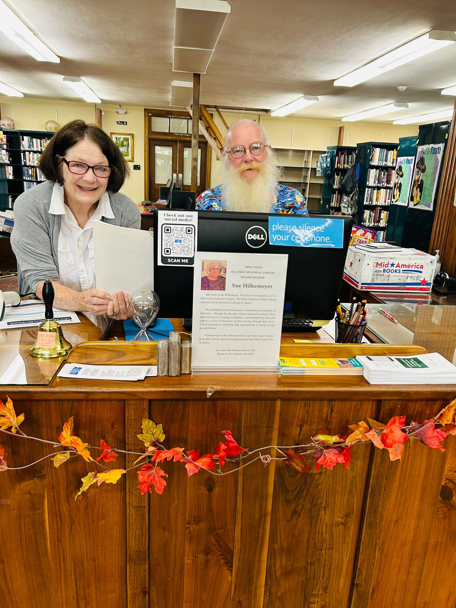 James - Librarian Ken Kelly and board president Linda Bland are happy ...