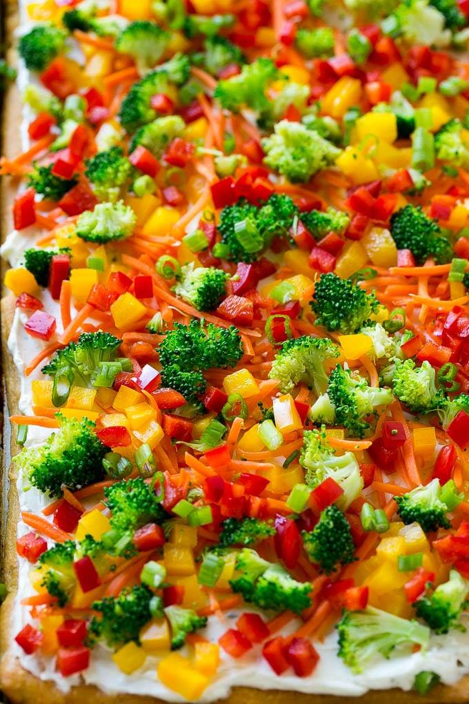 Ranch Veggie Pizza is a must make, with a soft crescent dough, loads of veggies, and a thick layer of ranch cream cheese!