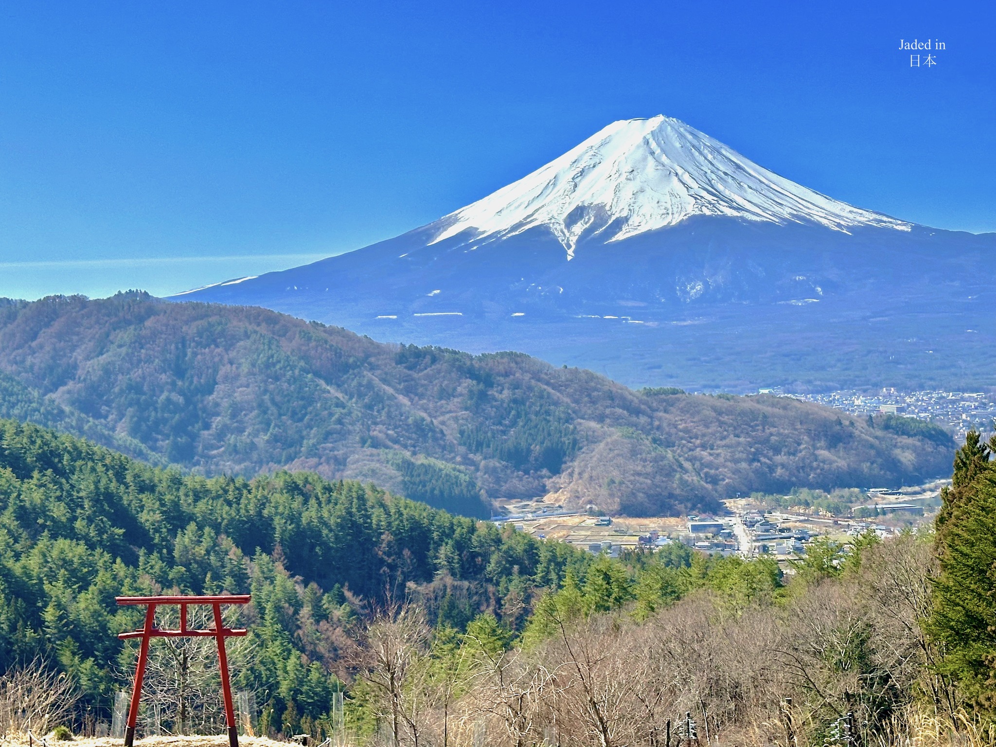 Mount Fuji viewed from the red Shinto gate known as Tenkū no torii