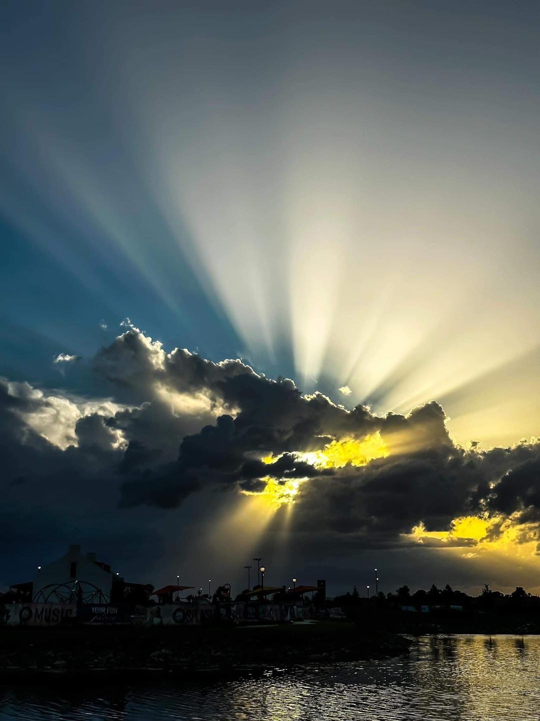 Ric - These are crepuscular rays, shafts of light which are seen just ...