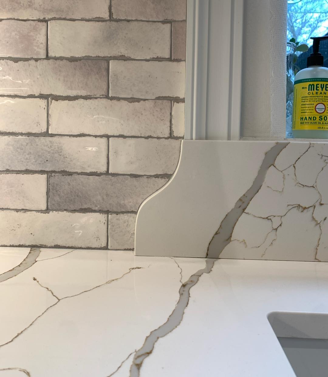 IKC - Tile cut along the edge of the backsplash. #marble #stone # ...