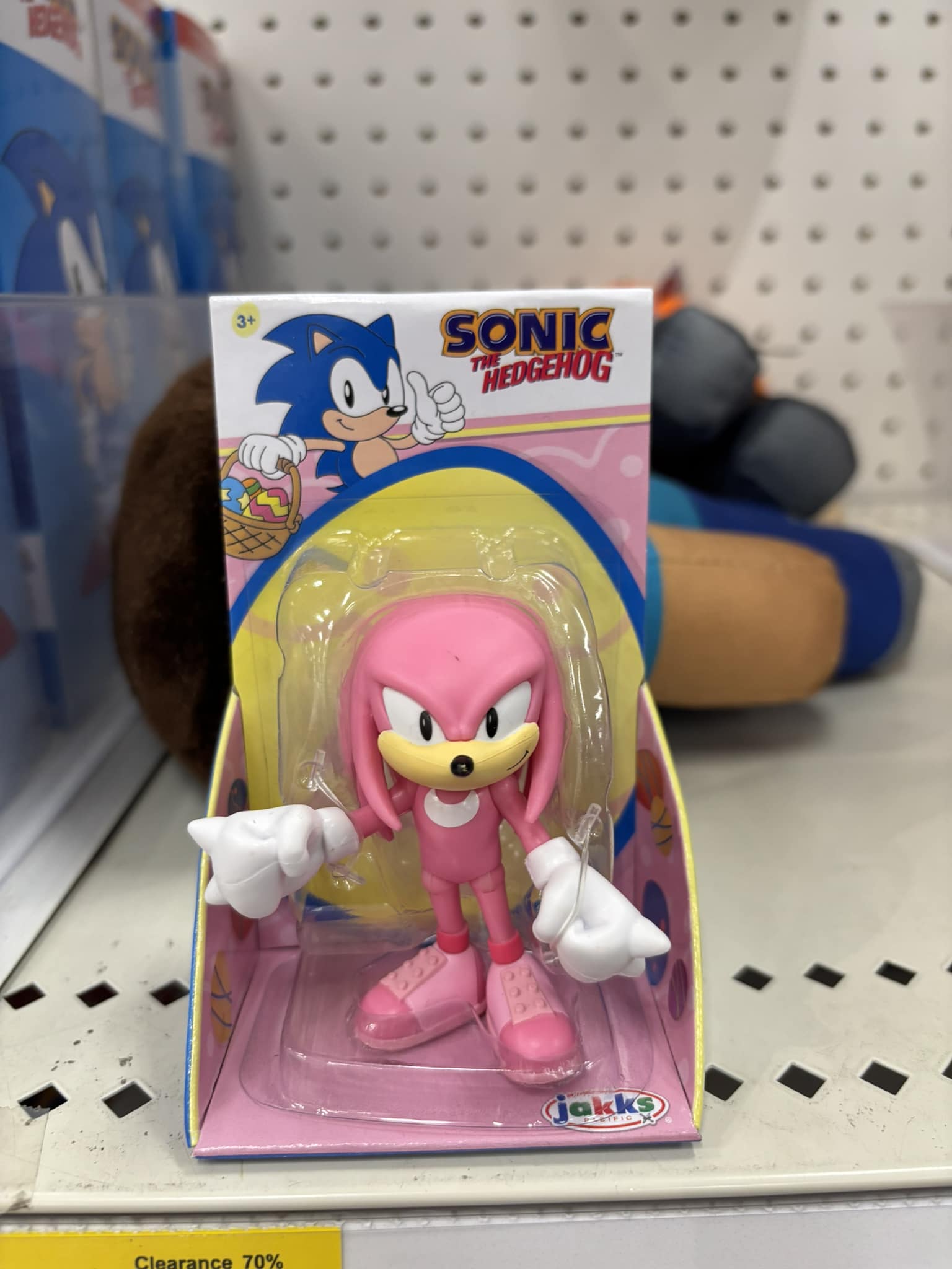 What is the meaning of the pink Knuckles action figure?