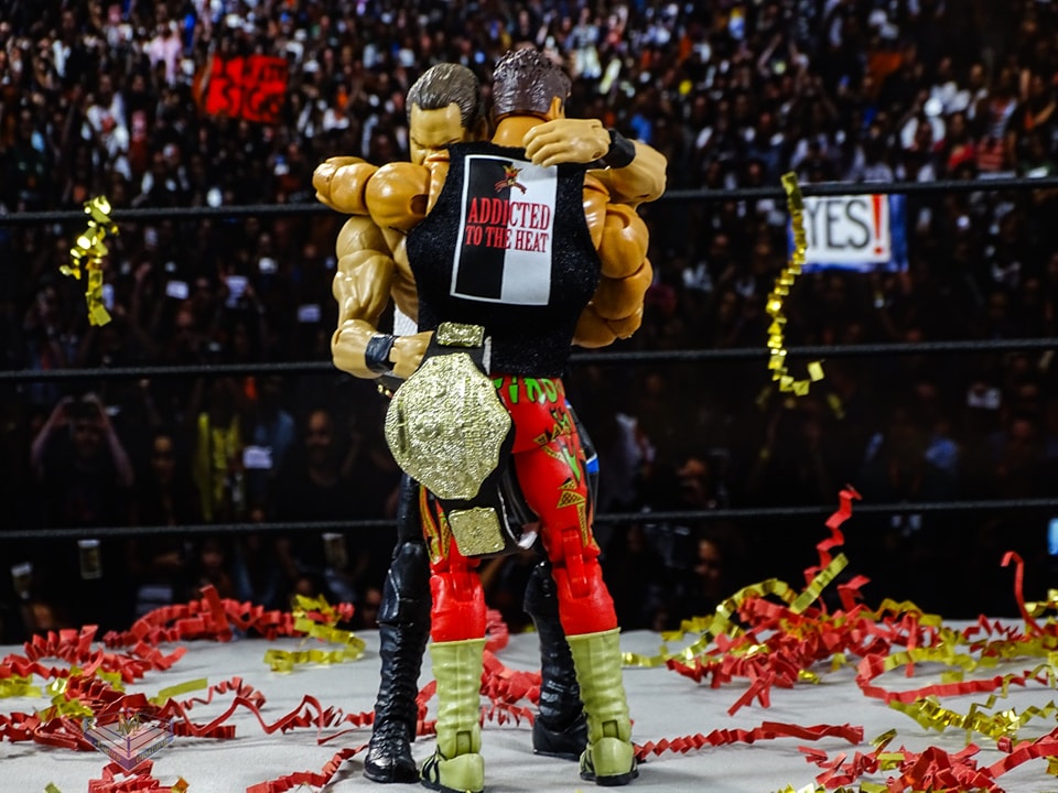 Benoit and Eddie Guerrero standing tall as champions at