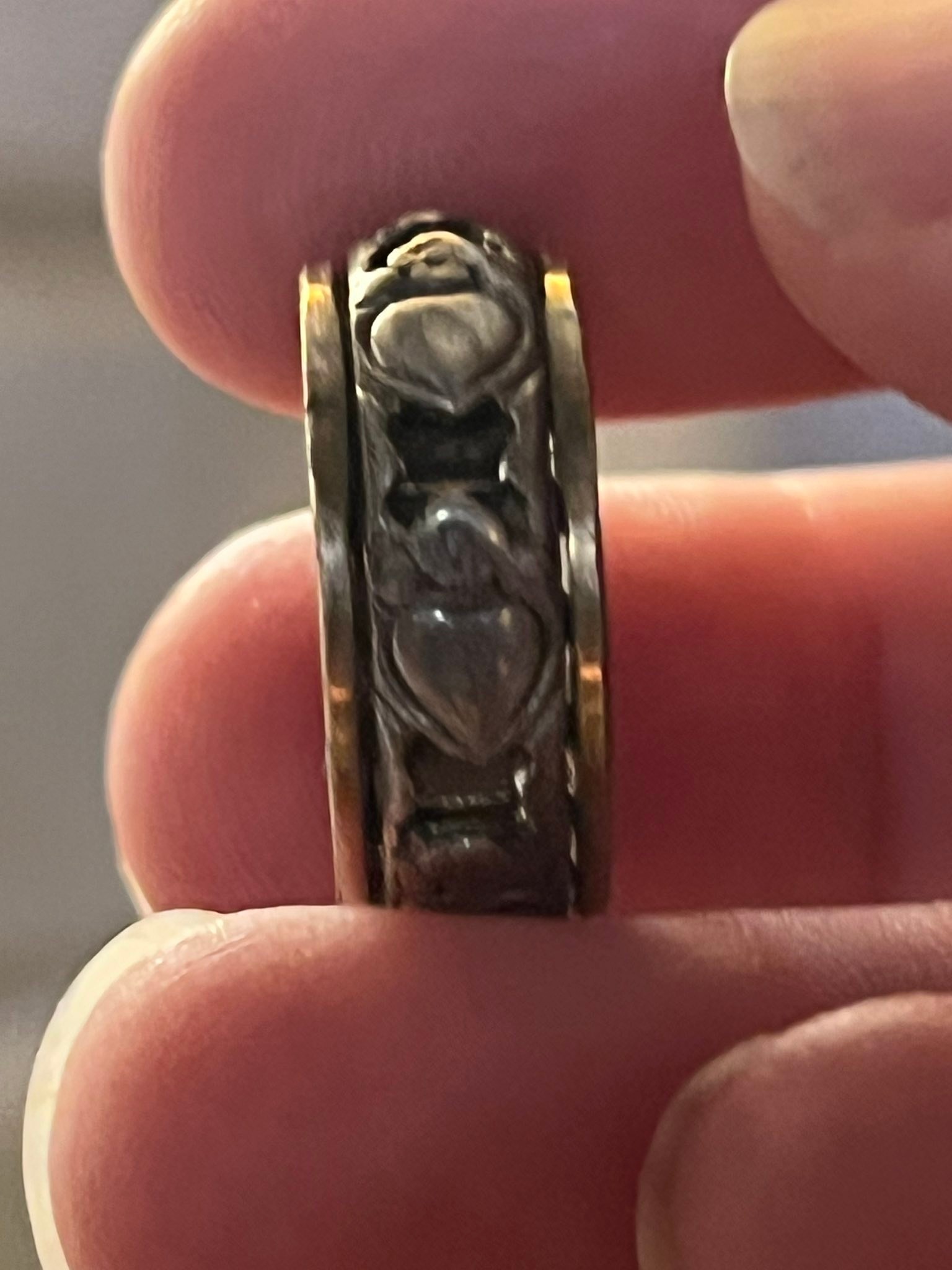 What is the origin and value of a vintage ring with intertwined 