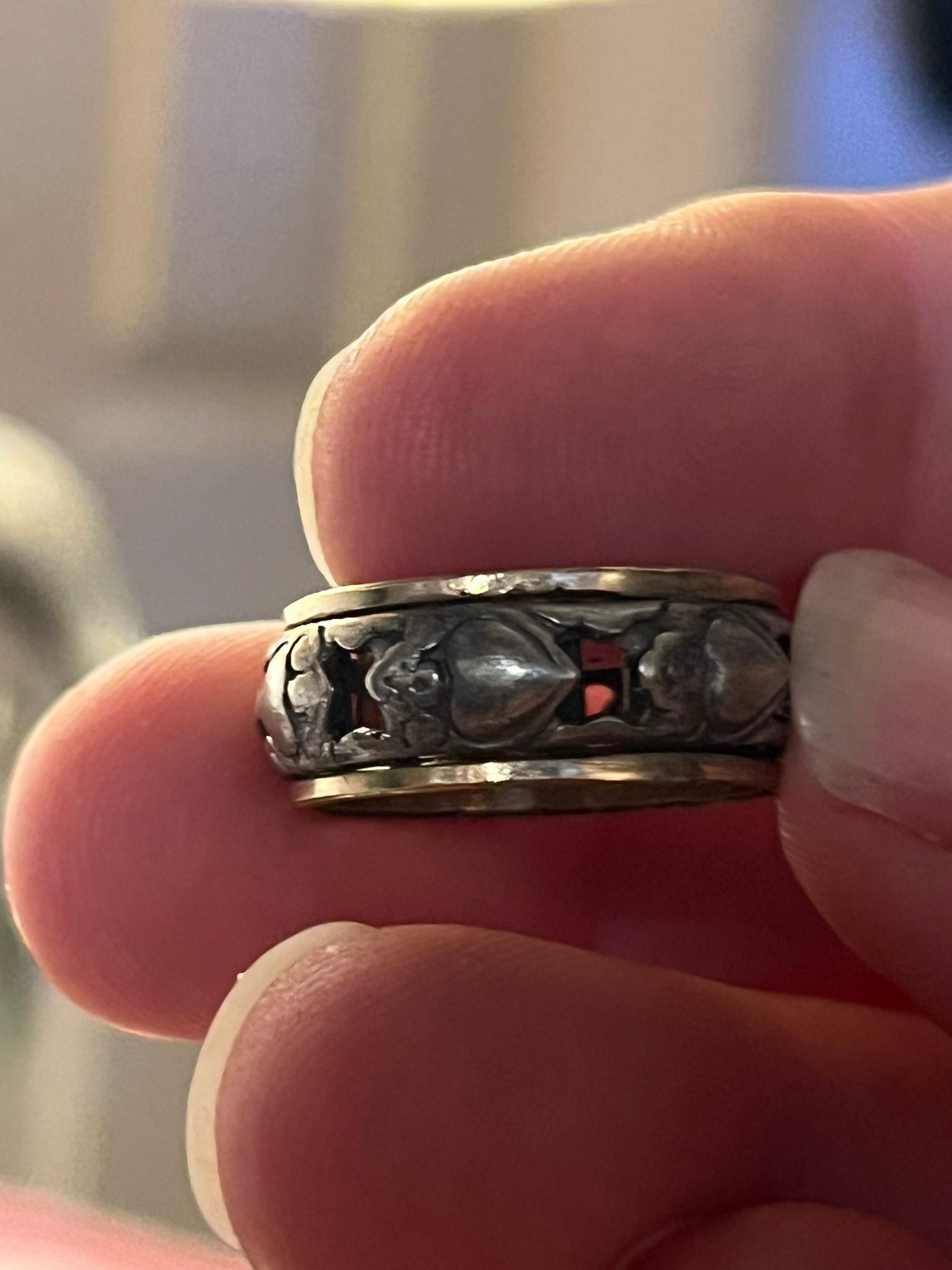 What is the origin and value of a vintage ring with intertwined 