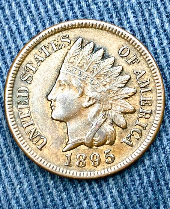 The 1899 Indian Head Cent is a classic United States bronze penny