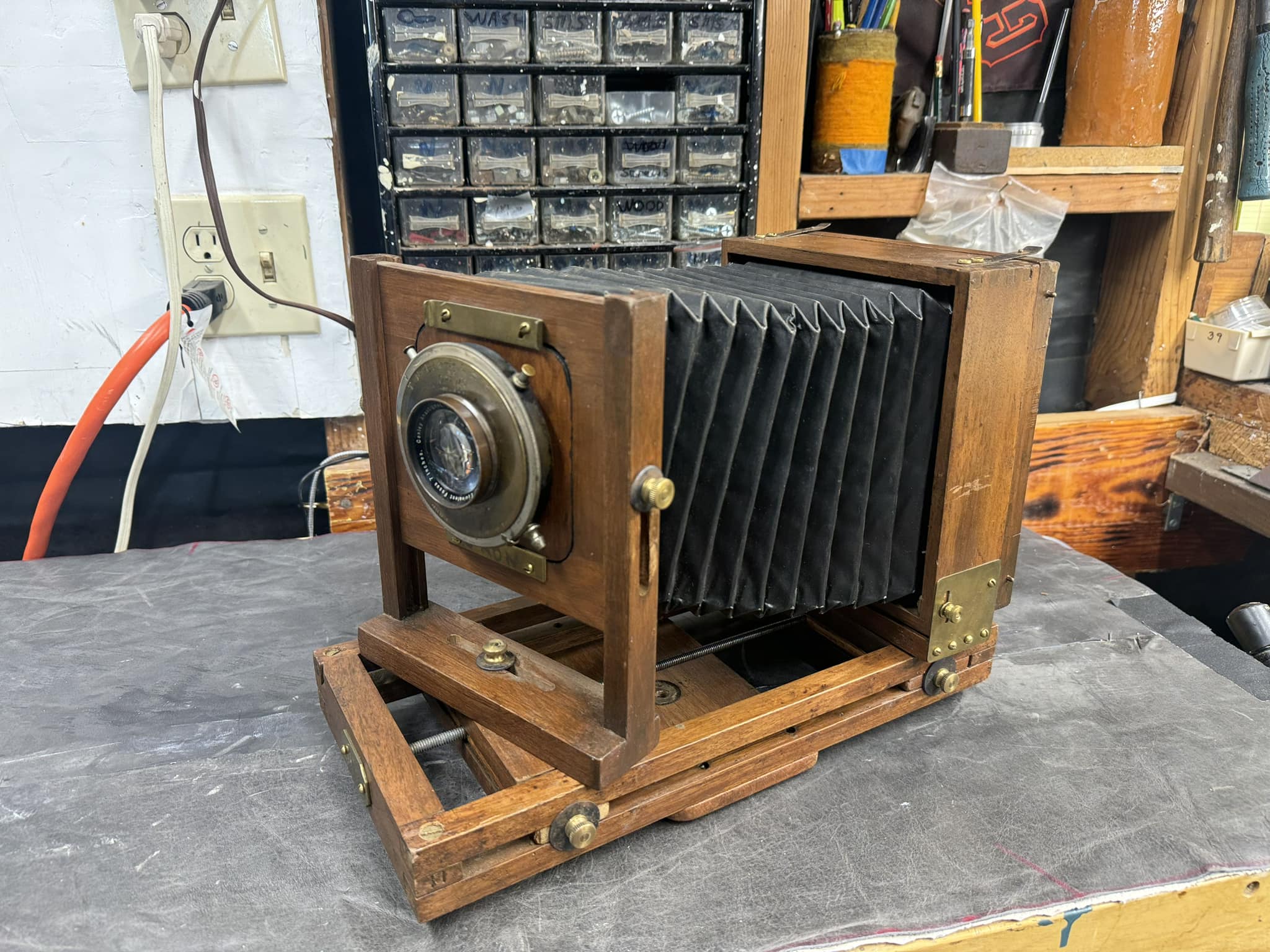 What is this old wooden 4x5 camera with Wollensak lens and Optimo