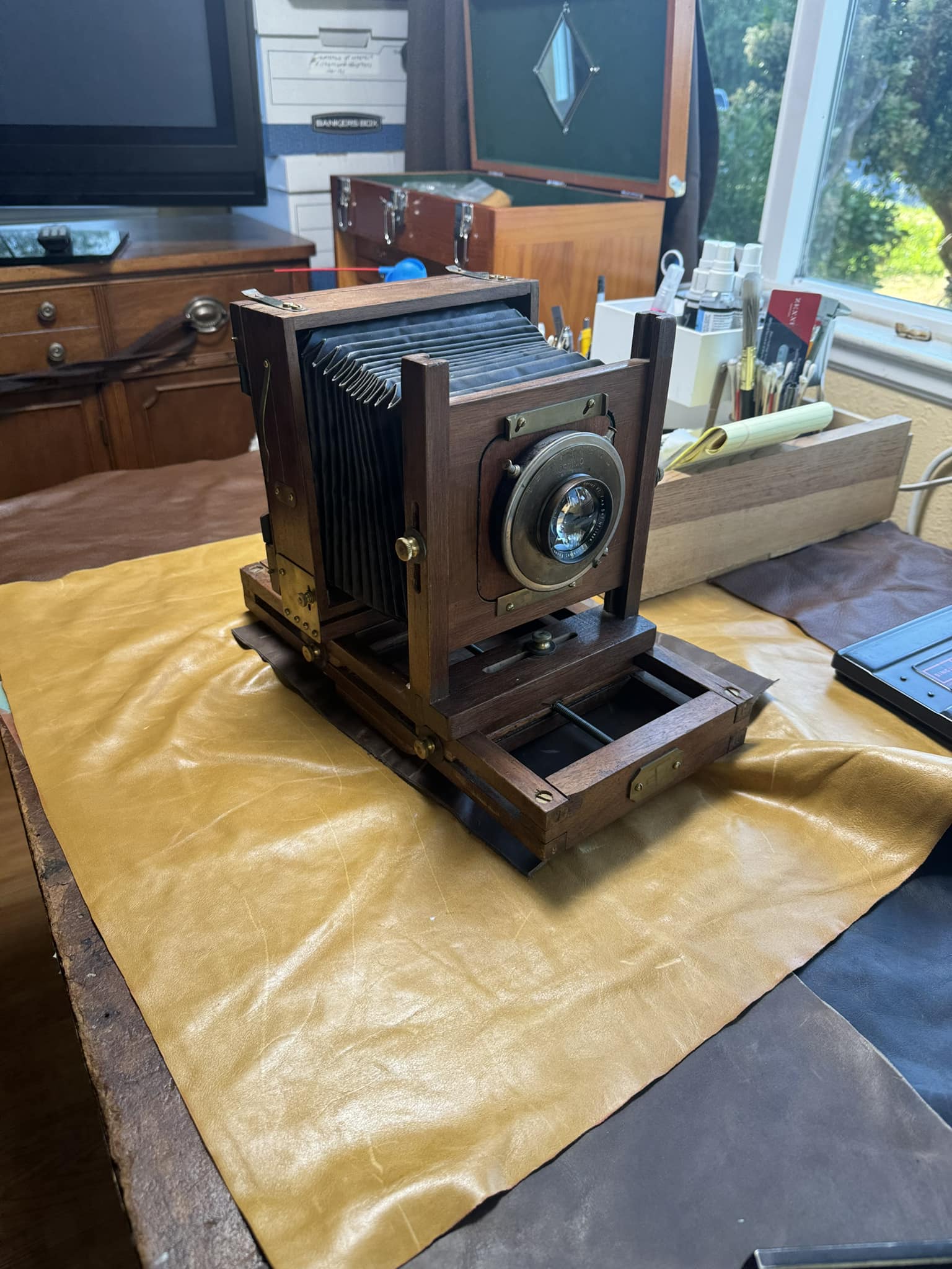 What is this old wooden 4x5 camera with Wollensak lens and Optimo