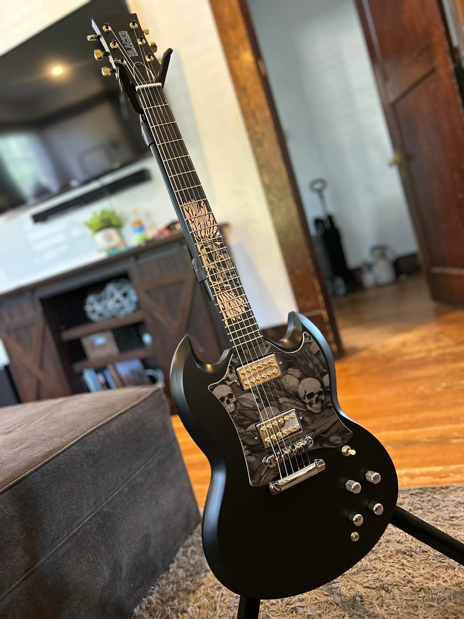 Custom SG guitar with unique wood inlays and Dragonfire Crusader