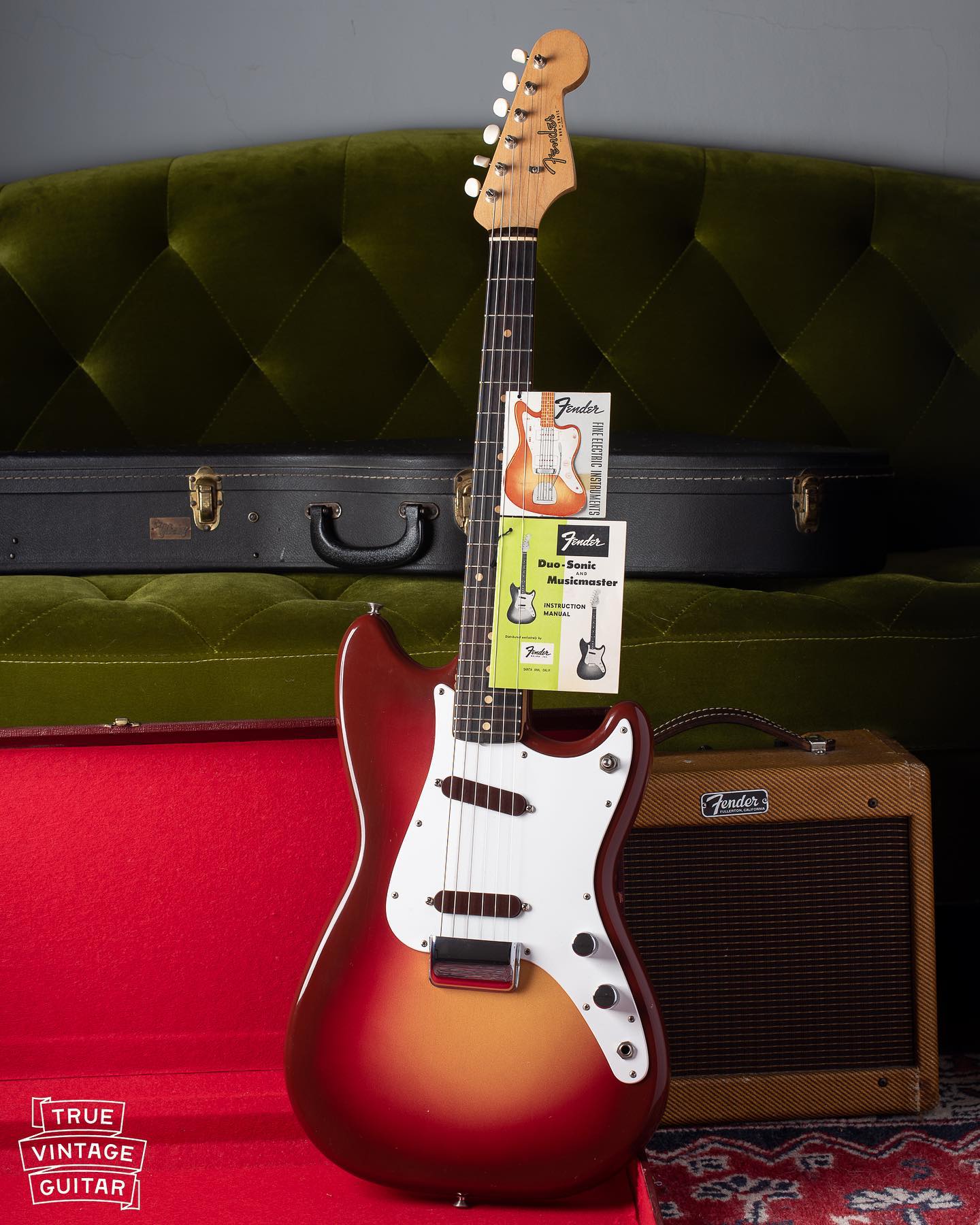 1961 Fender Duo Sonic with the tag, strap, and spaghetti logo