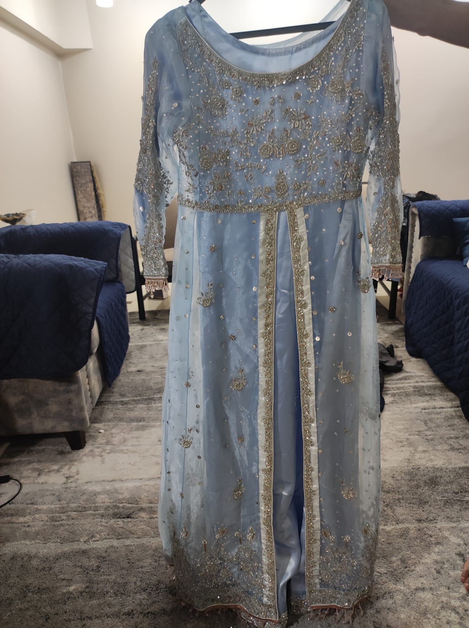 blue grey walima dress Selling this beautiful dress. In powder blue. It's in good condition. The last picture shows how it's supposed to look but my bottom gown is shorter as shown in pic. Overall EU Outlet