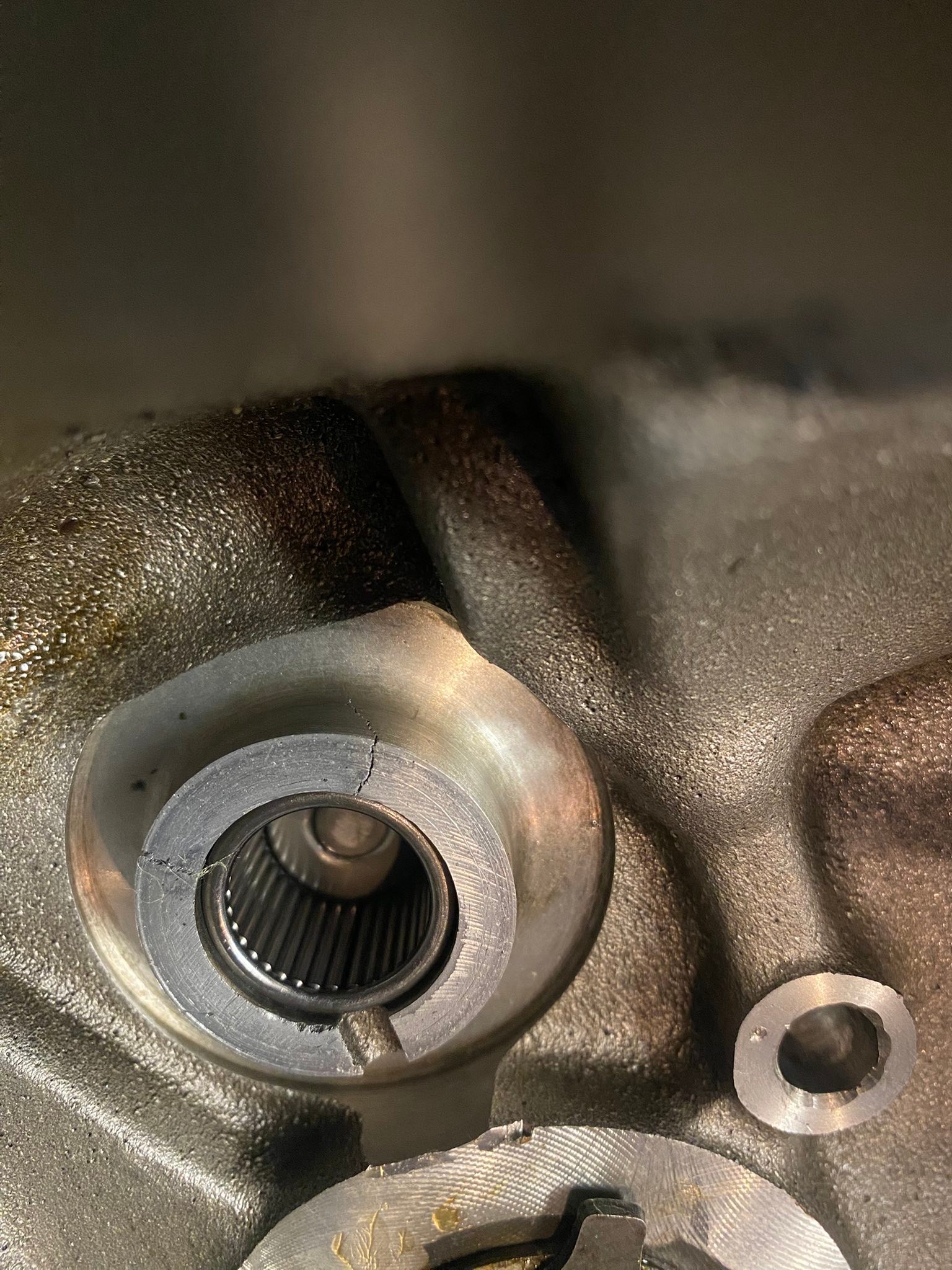 How to fix cracks around bearing in ironhead gear housing?