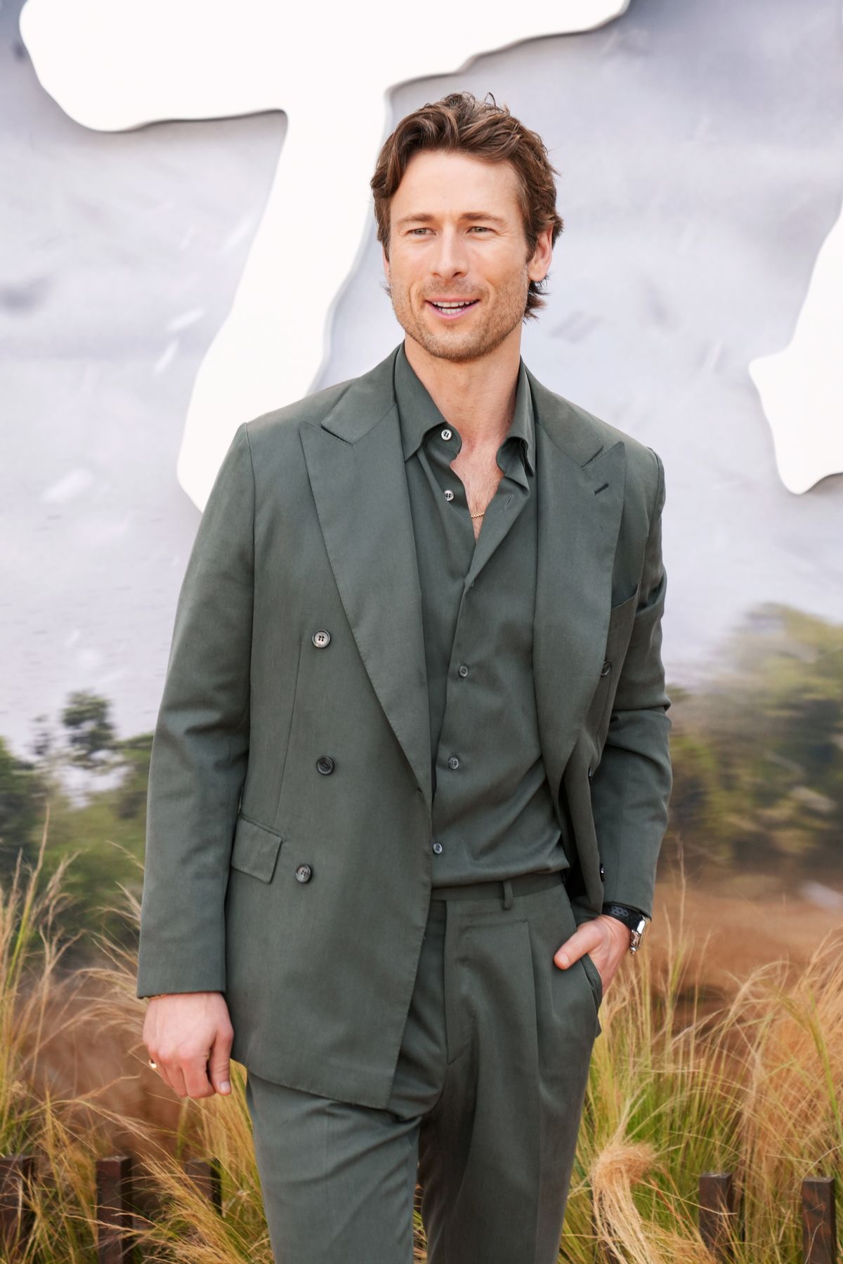 All the cool guys are wearing double-breasted suits this summer 