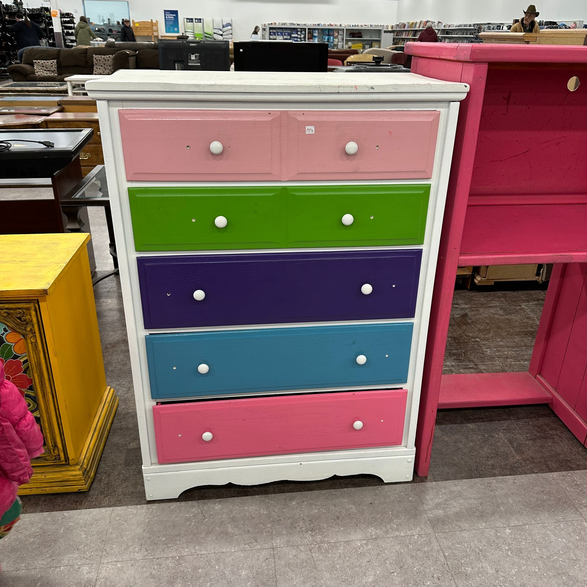 dresser with sunshine lady face Check out this 🌈rainbow🌈 painted we found at our thift store for $60! Could be a fun idea for a little kids room! Metal hardware covered in