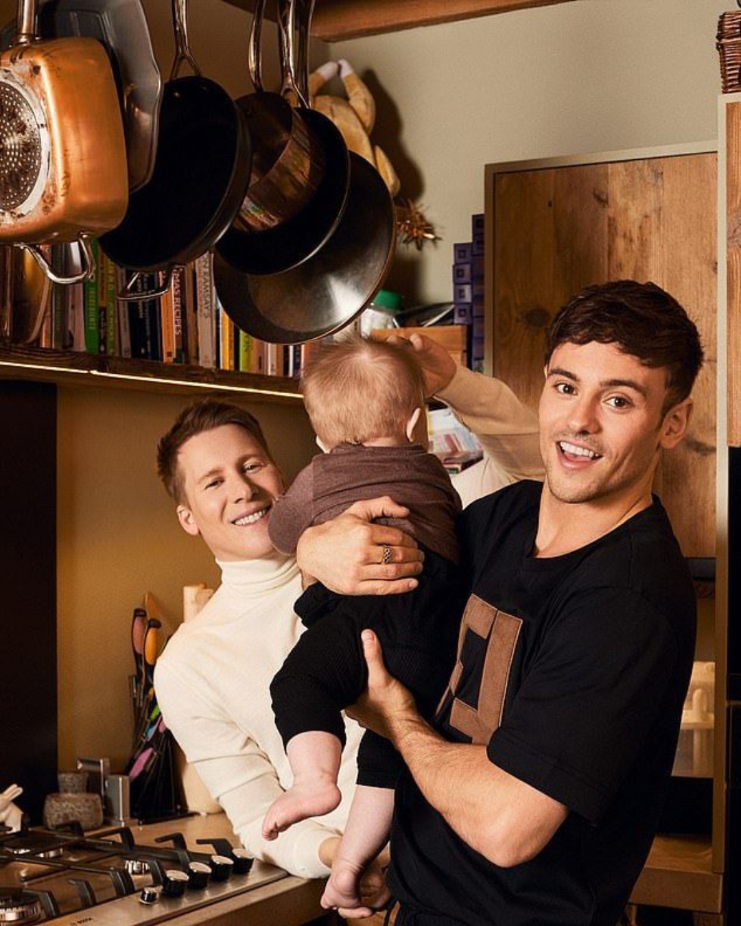 Anything - Gordon Ramsay and Tom Daley posing with their son