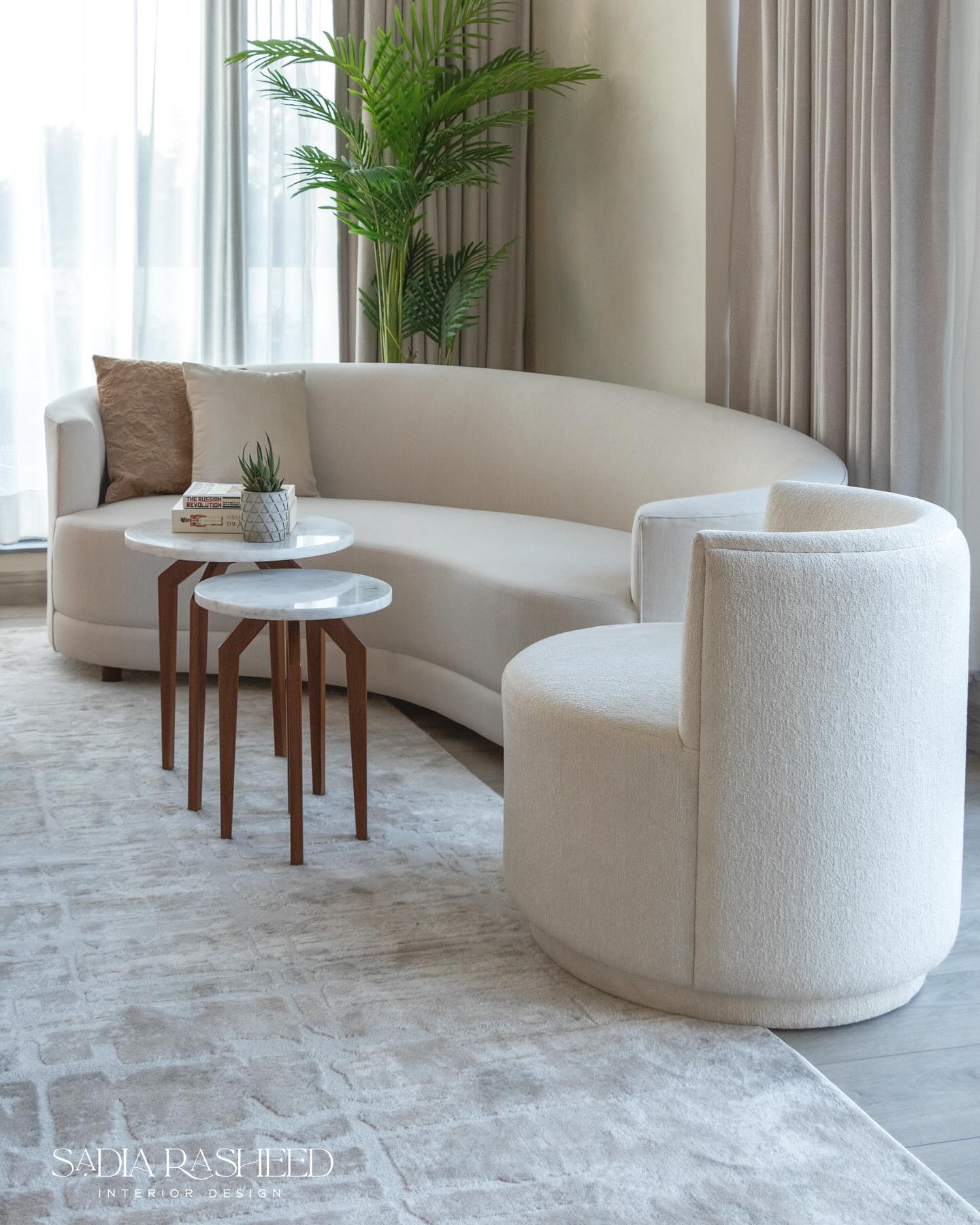 Sadia Rasheed - This elegant curved sofa is a refined and... | Facebook
