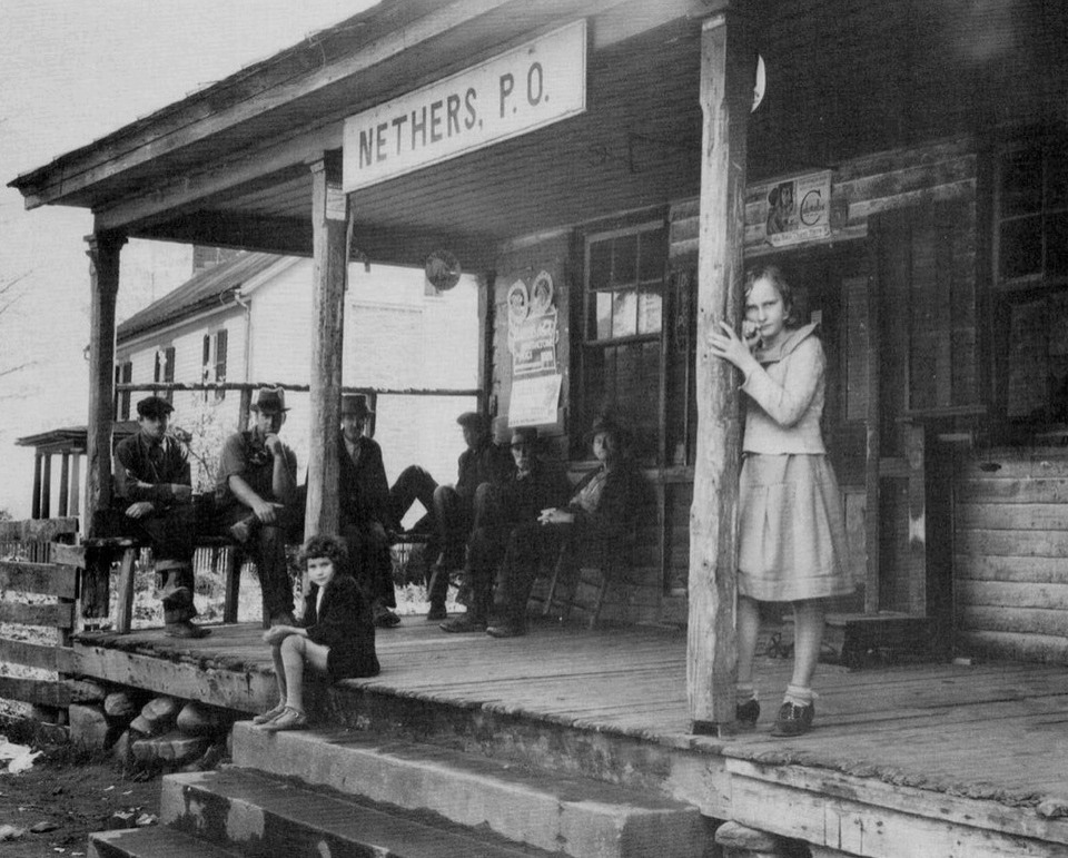 A group of men photographed by Arthur Rothstein outside a post