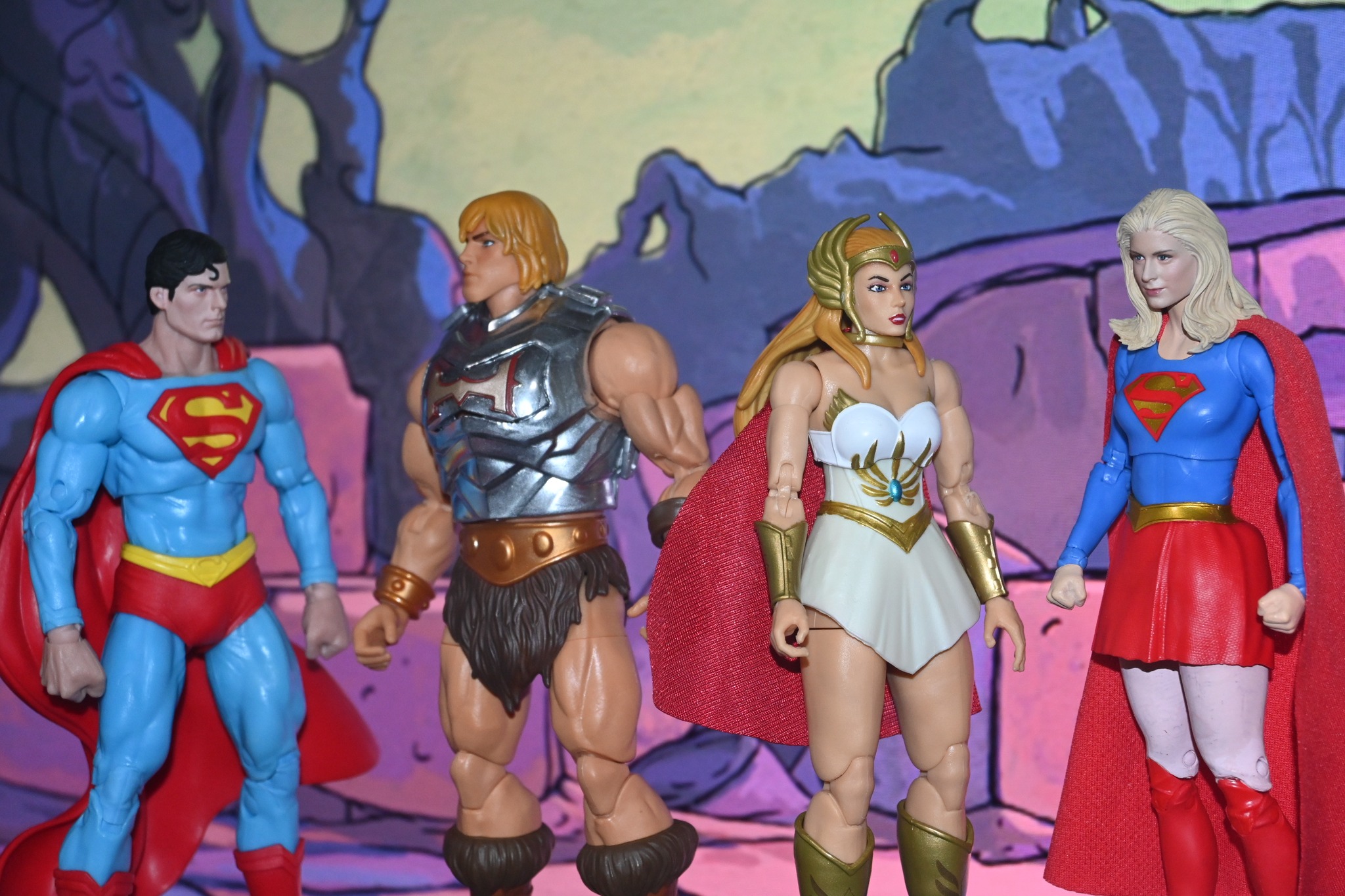He-Man and Superman discuss magic defenses with She-Ra and Supergirl