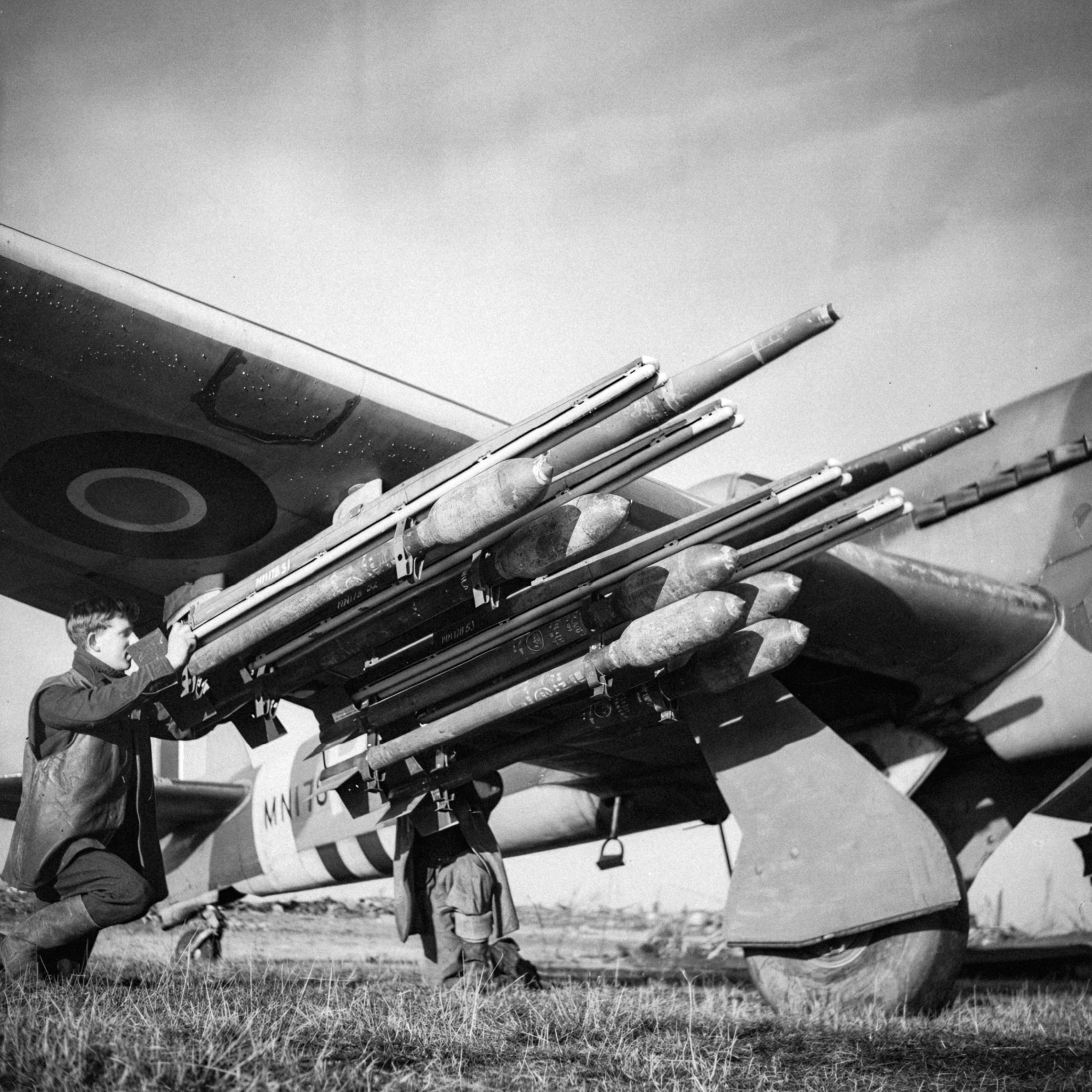 World - Armourers fit two extra 60-lb rocket-projectiles to the four ...