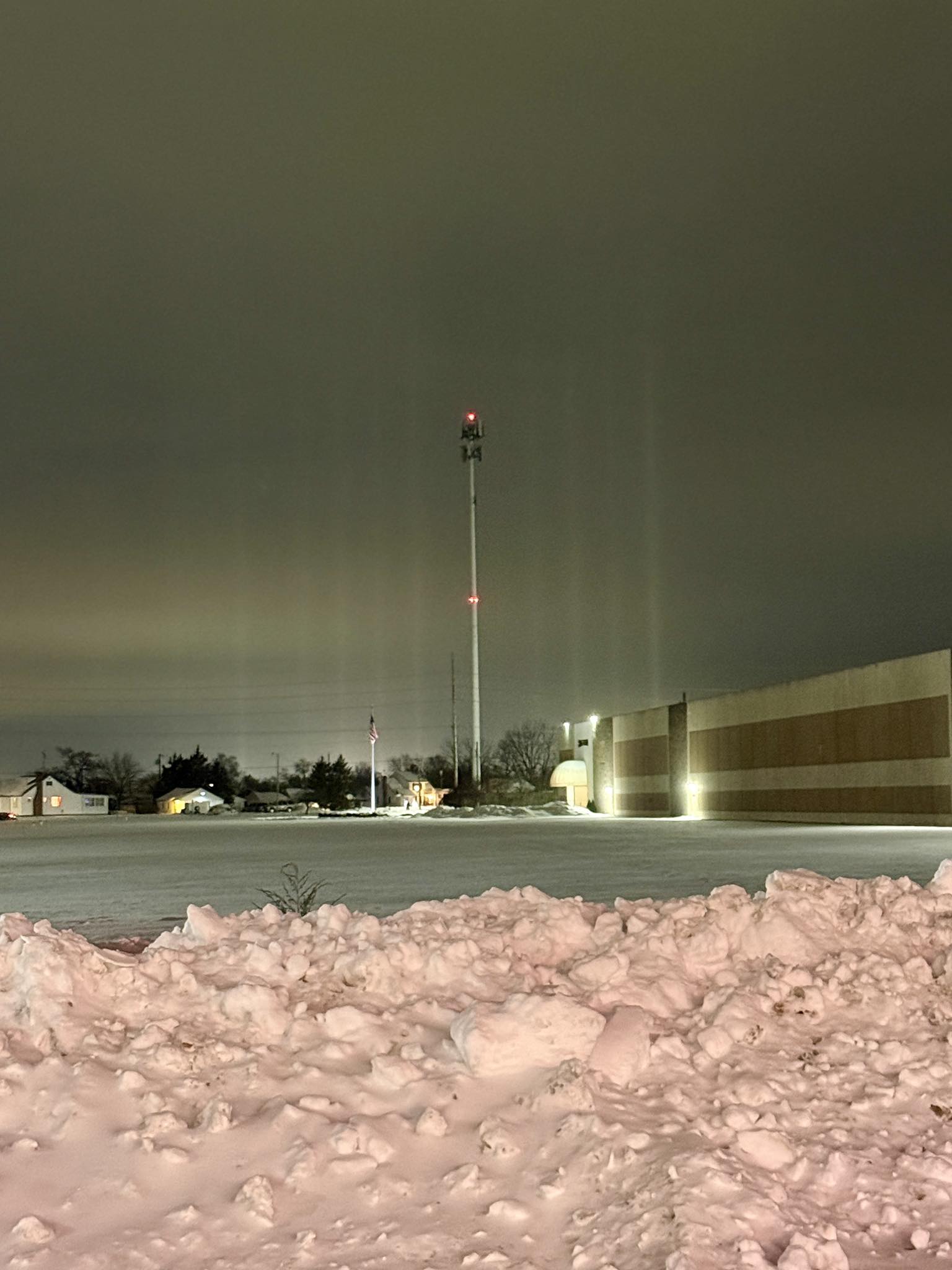 Light pillars over snowy landscape explained