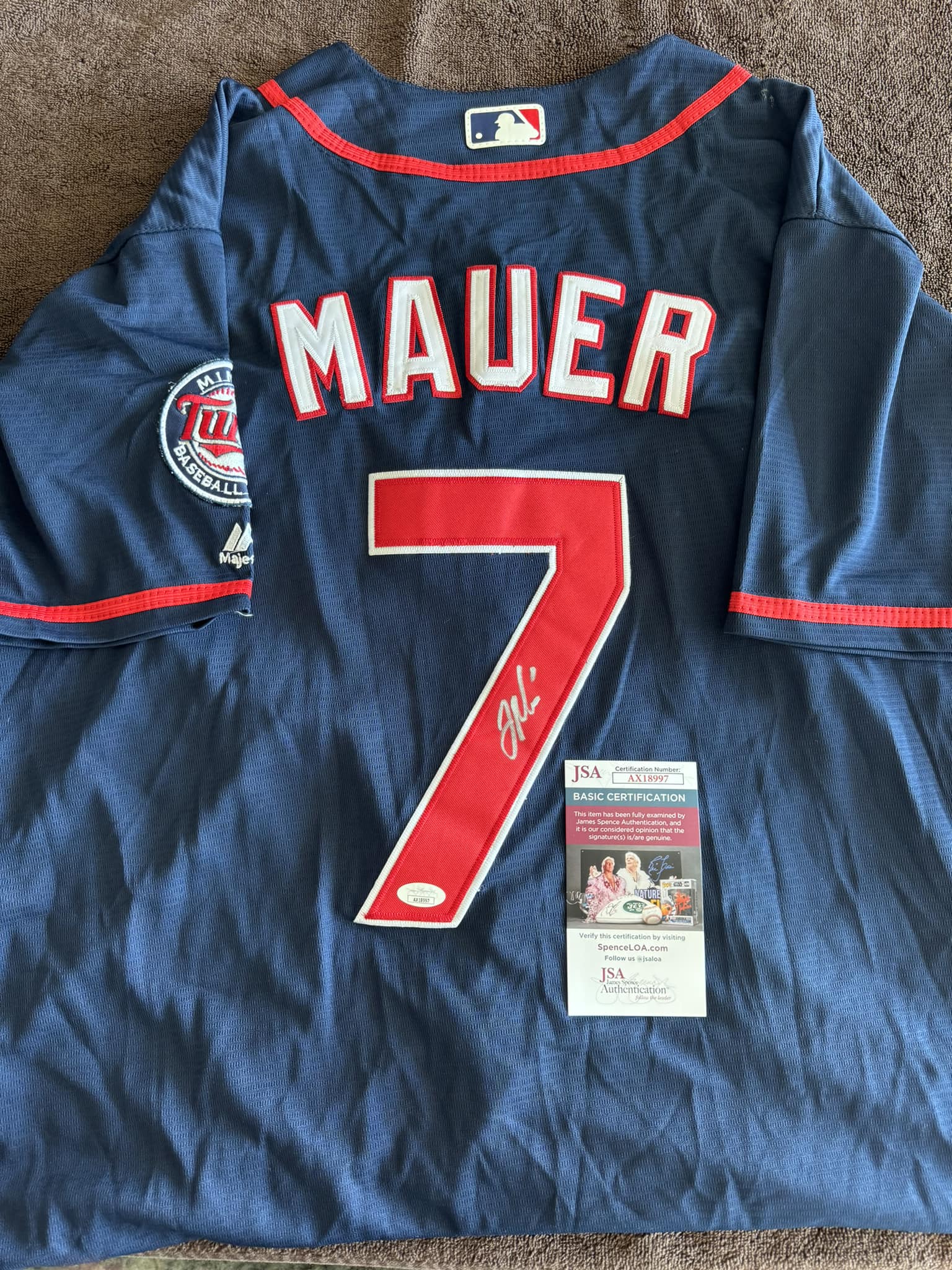 The product is a Majestic Minnesota Twins Joe Mauer home jersey