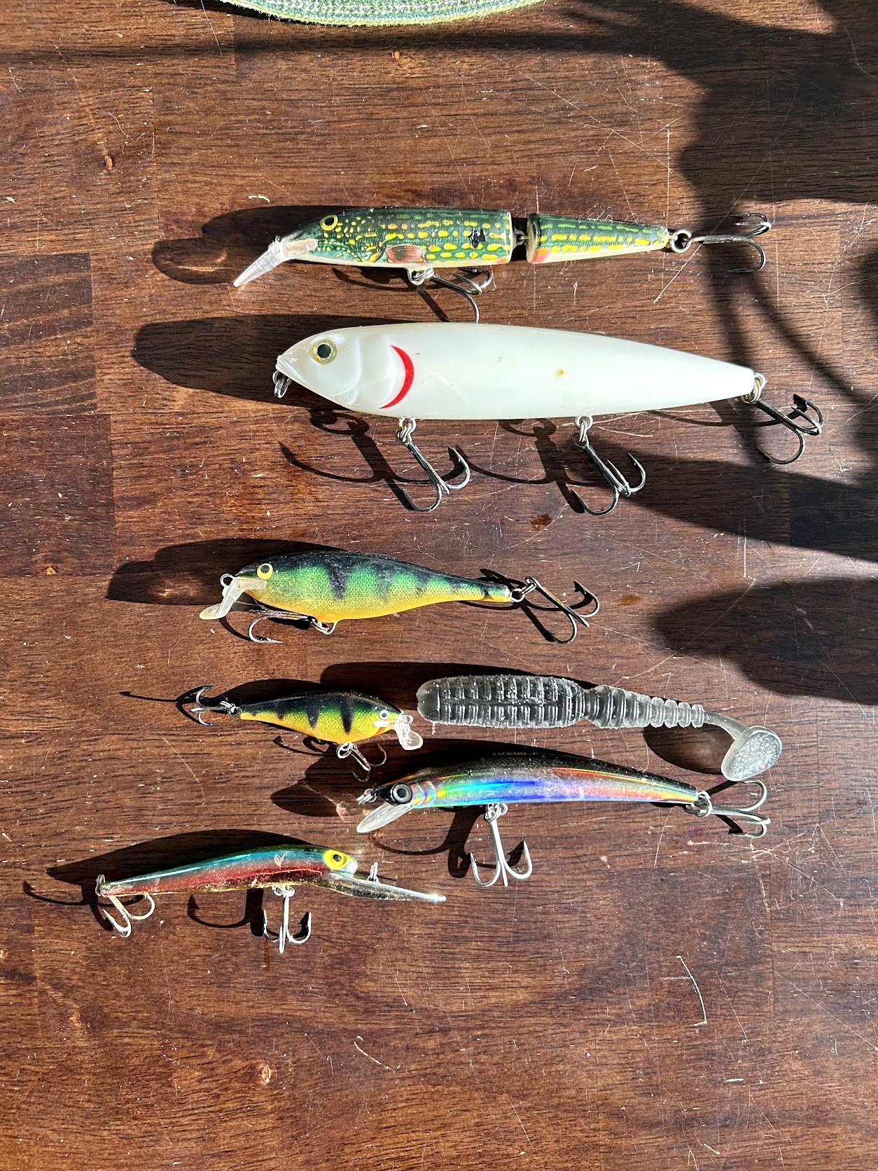 buy used fishing lures Collection of Painted Wooden and Metal c.1940 representative color photographs that the company made Fishing lures, never used -
