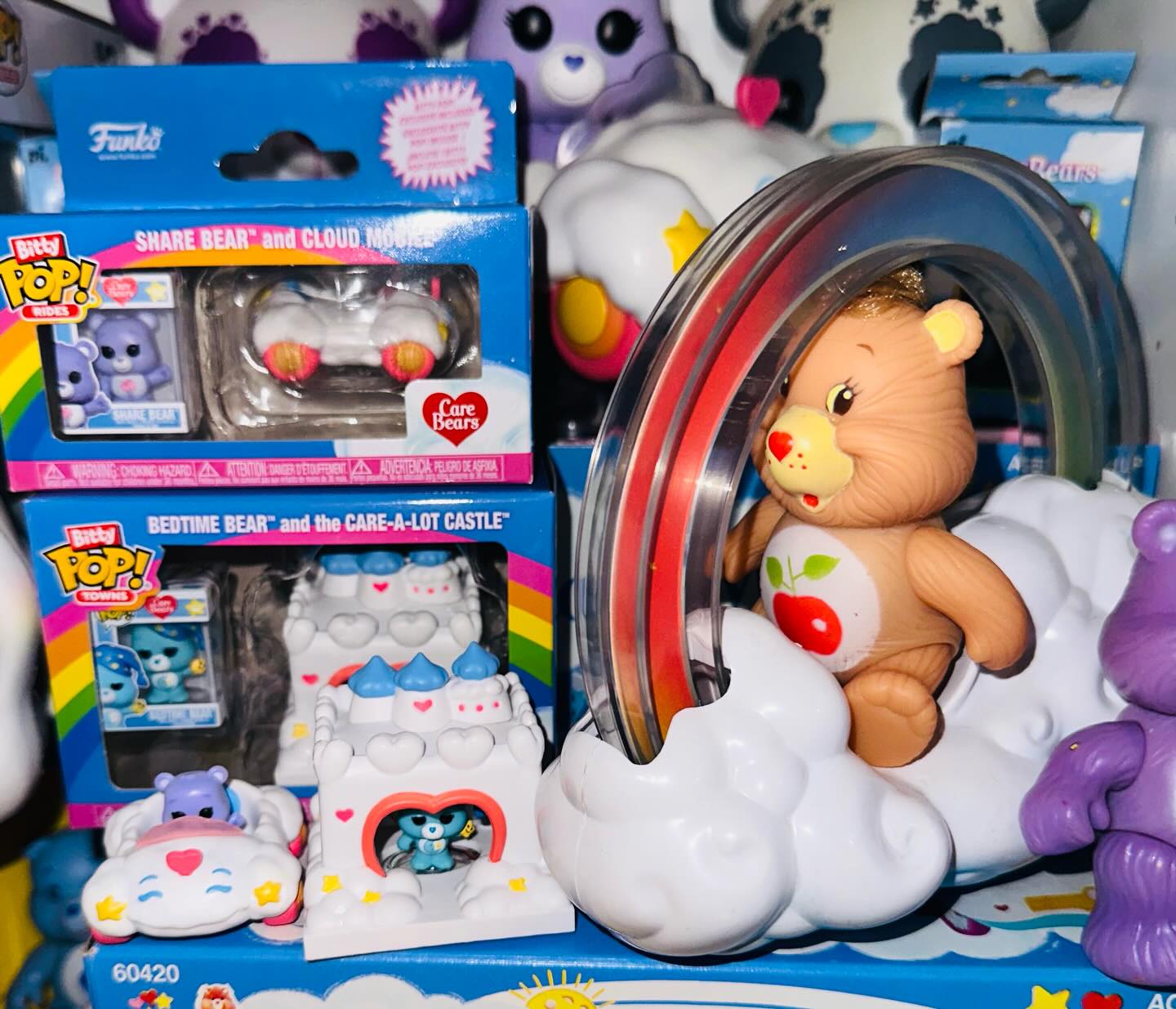 ILLIT × Care Bears Japan featuring scrunchies and dolls with ILLIT